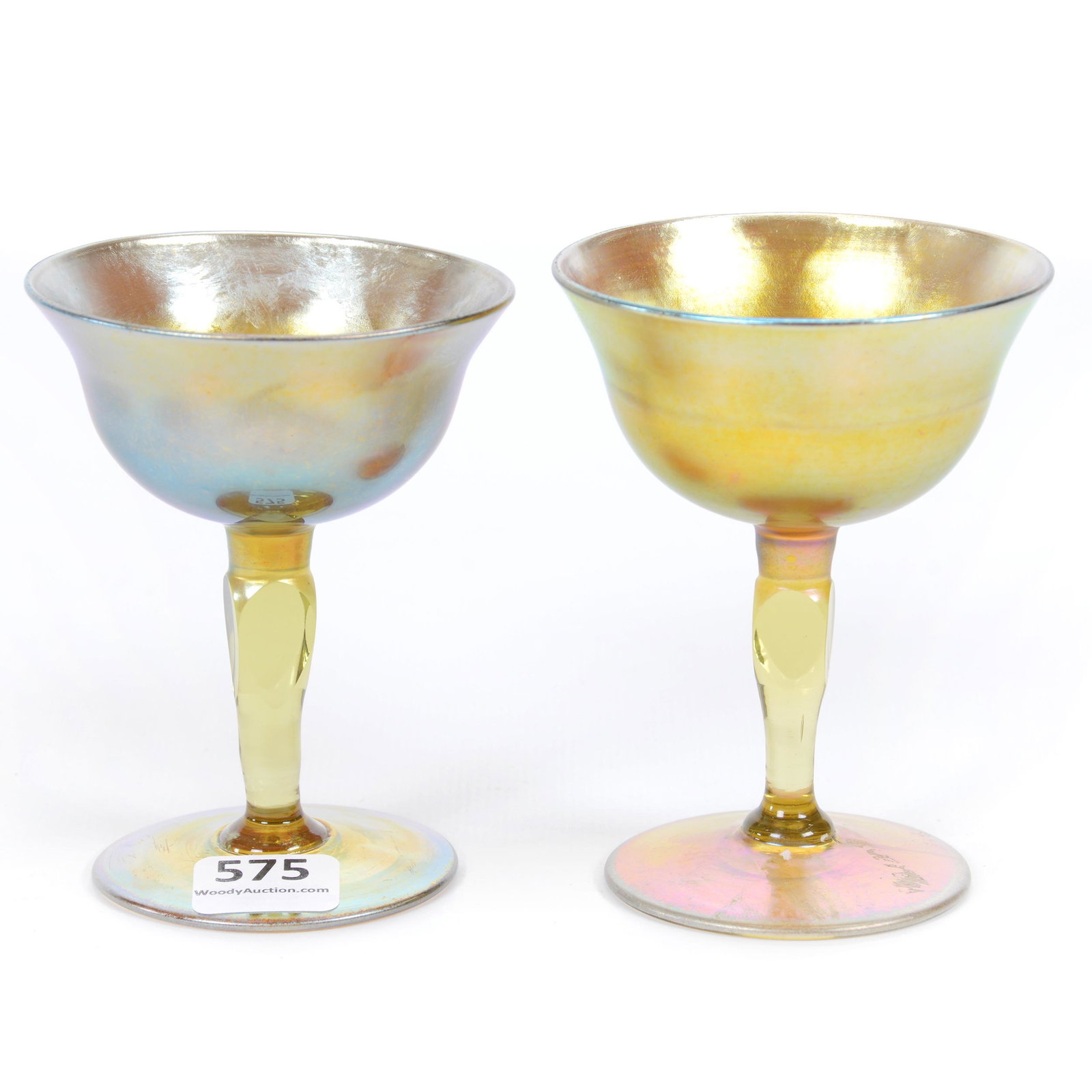 Pair Wine Stems Signed LCT Favrile Art Glass: Pair Wine Stems Signed LCT Favrile Art Glass, Both Are Gold Iridescent, Both Have Four-Sided Cut Stem, Slight Height Variation, (1) 3.75", (1) 3.875", Private Collection, IL.