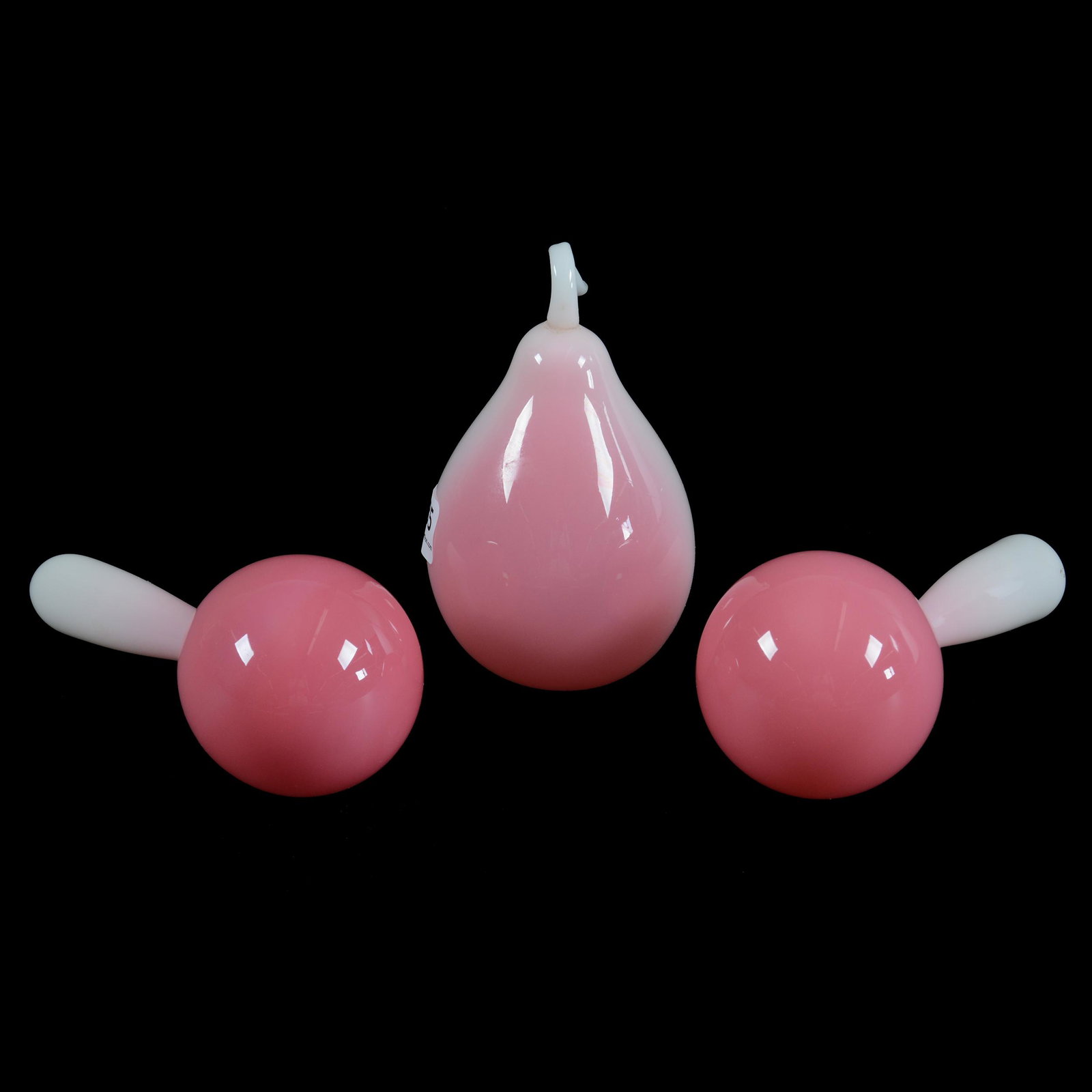 (3) Glossy Peachblow Art Glass Items: (3) Glossy Peachblow Art Glass Items, (2) 5", Sock Darners, (1) 4.5" Pear With Long Stem, Dr. Peter & Grace Jochimsen Collection, Iowa.