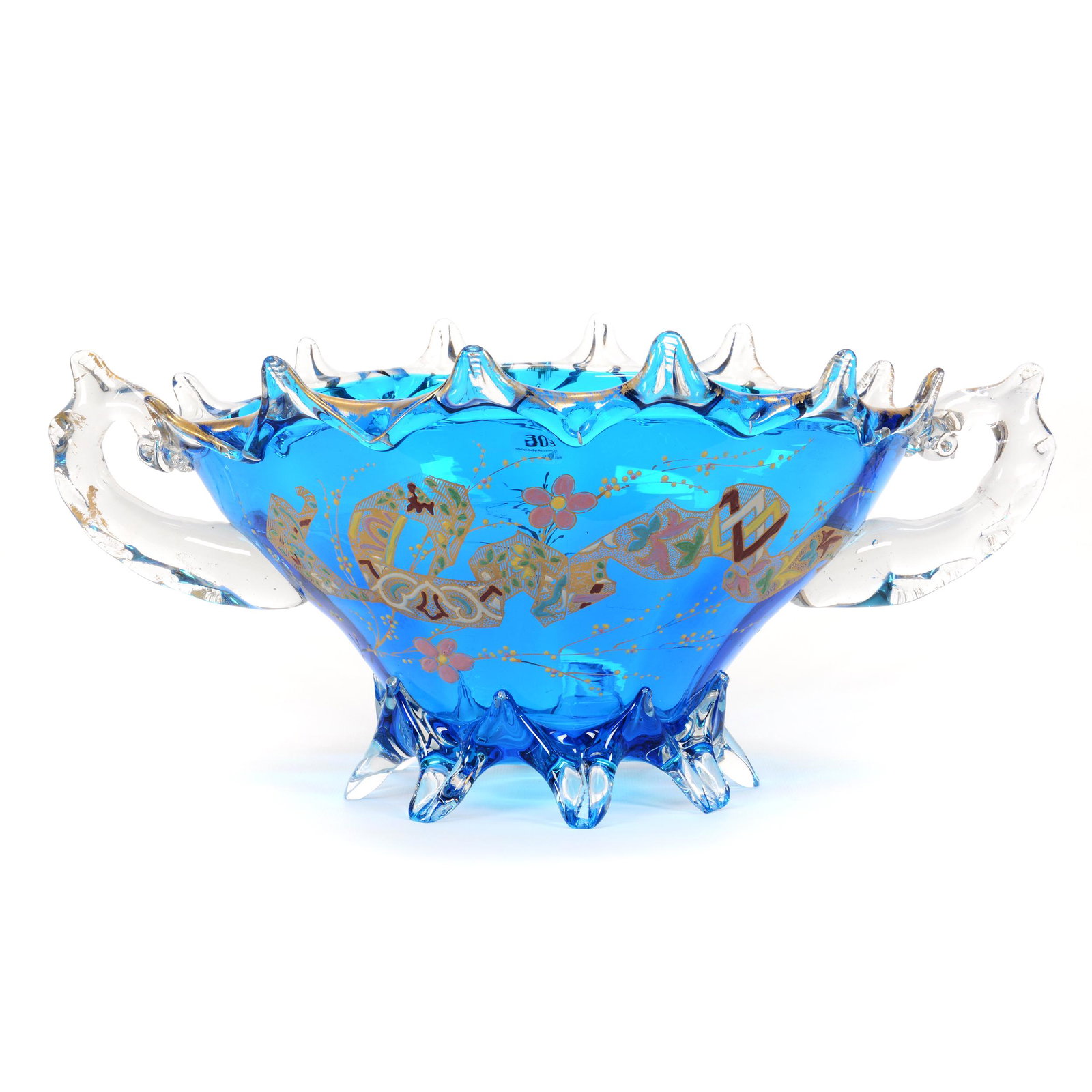 Footed Centerpiece, Sapphire Blue Art Glass: Footed Centerpiece, Sapphire Blue Art Glass, 8.25" x 17.75" x 10.5", Colorful Enamel Floral And Banner Design, Clear Applied Glass Feet, Handles And Rim, Nice Quality, Don Henson Estate, Michigan. Thi
