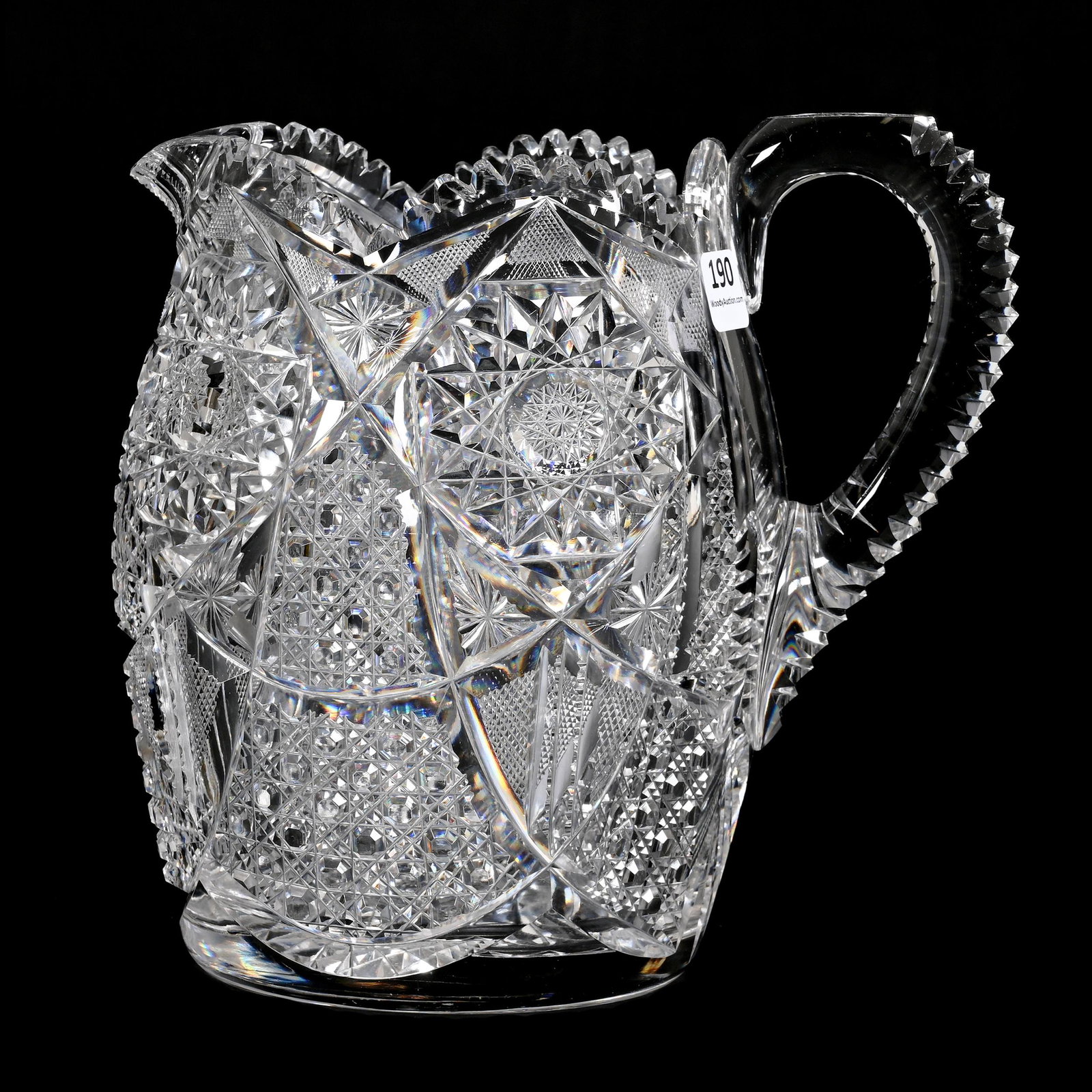 Pitcher, American Brilliant Cut Glass: Pitcher, American Brilliant Cut Glass, 7.75" x 7.75", Well Cut Hobstar, Cane, Strawberry Diamond, Star And Prism Motif, Notched Handle, Hobstar Base, Inside Rim Chip, From The Collection Of Barbara An