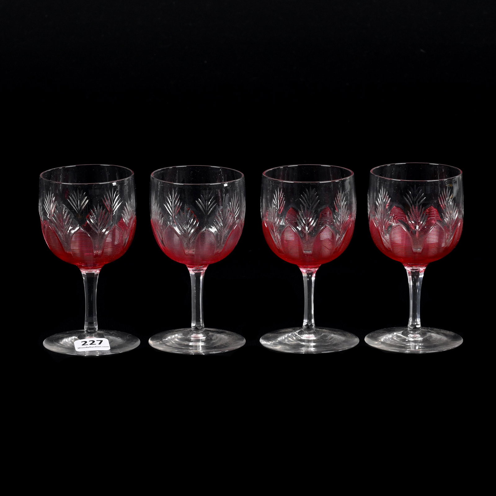 (4) Wine Stems, Clear Art Glass: (4) Wine Stems, Clear Art Glass, 4.5" x 2.5", Cranberry Threaded Overlay Cutback Design, Don Henson Estate, Michigan. Part 3. This auction is the final dispersal of a collection of over 1,700 items se