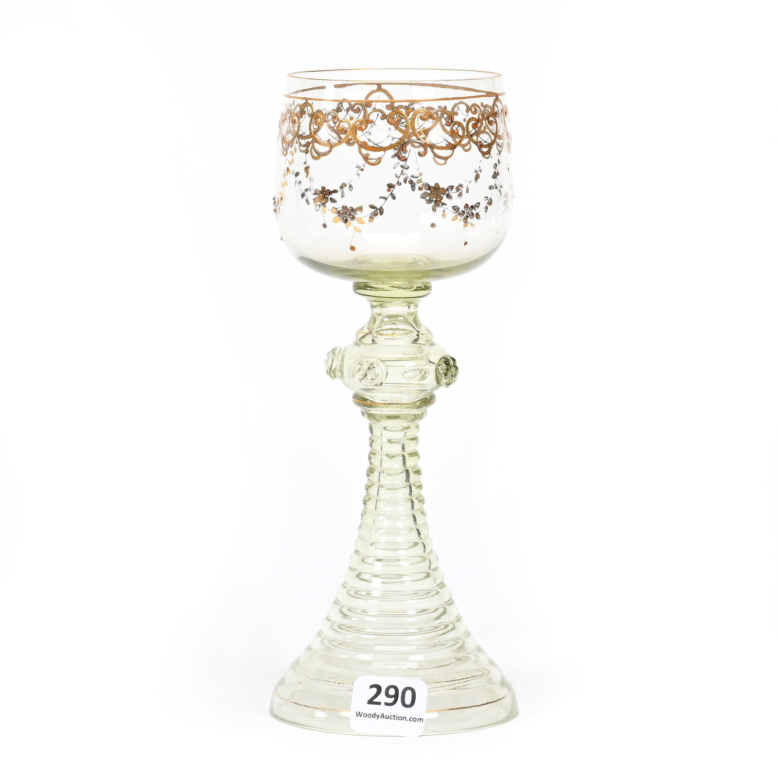 Wine Stem, Vaseline Bohemian Art Glass: Wine Stem, Vaseline Bohemian Art Glass, 7.5" x 3", Gold Enamel Garland And Scroll Design, Applied Prunts, Reactive Under Black Light, Don Henson Estate, Michigan. Part 3. This auction is the final dis