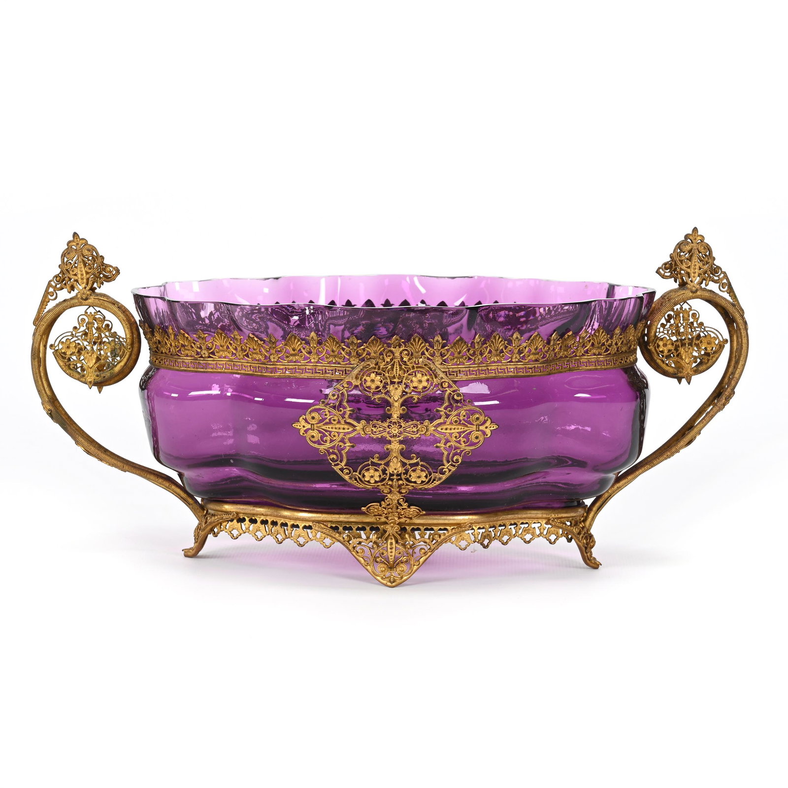 Center Bowl, Amethyst Art Glass: Center Bowl, Amethyst Art Glass, 6" x 12.5" x 6", Elaborate Gilt Metal Filigree Frame, Handles, Trim And Feet, Minor Rim Polish, Don Henson Estate, Michigan. Part 3. This auction is the final dispersa