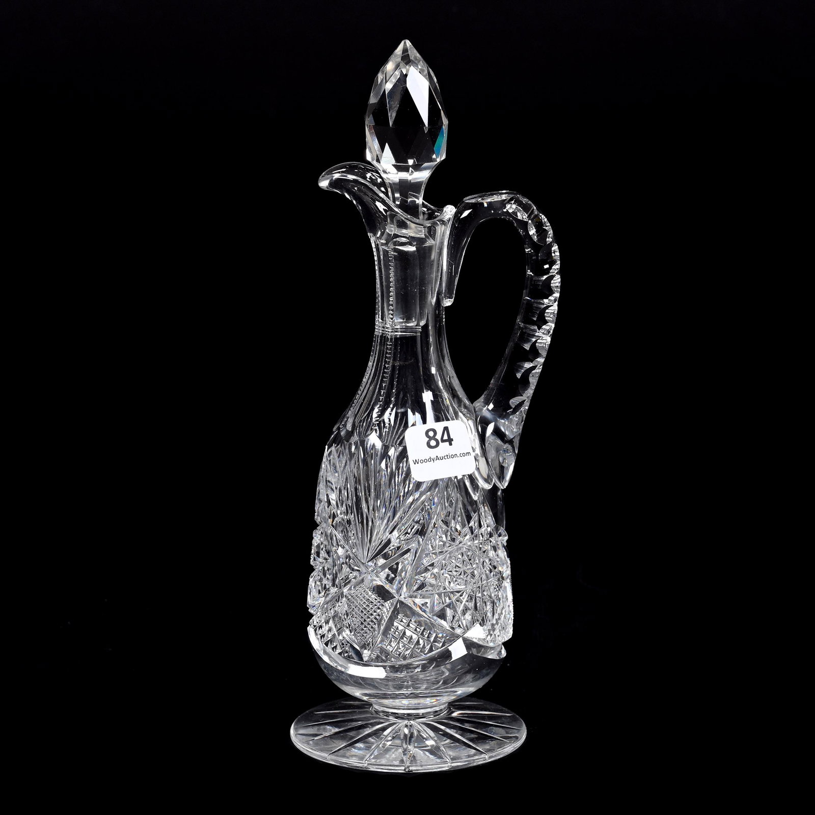 Pedestal Cruet, American Brilliant Cut Glass: Pedestal Cruet, American Brilliant Cut Glass, 9" x 3", Hobstar, Strawberry Diamond, Crosscut Diamond, Ray Cut Foot, One Nick On Stopper, Two Slight Slivers On Stopper Plug, Dennis R. Lemon Collection.