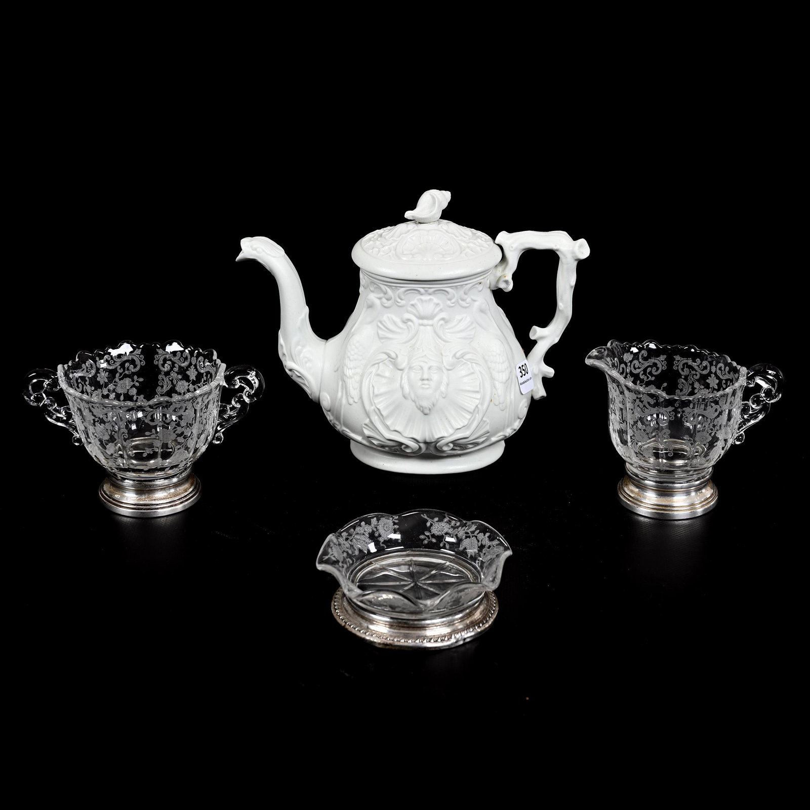 Tea Pot, White Salt Glaze, Scottish: Tea Pot, White Salt Glaze, Scottish, 6.25" x 7.75", Attributed To Kidscon & Company Of Anderston Glascow, Shell, Stork And Bust Features, Faint Hard To See Hairline, Lid Has Two Chips - This Tea Pot S