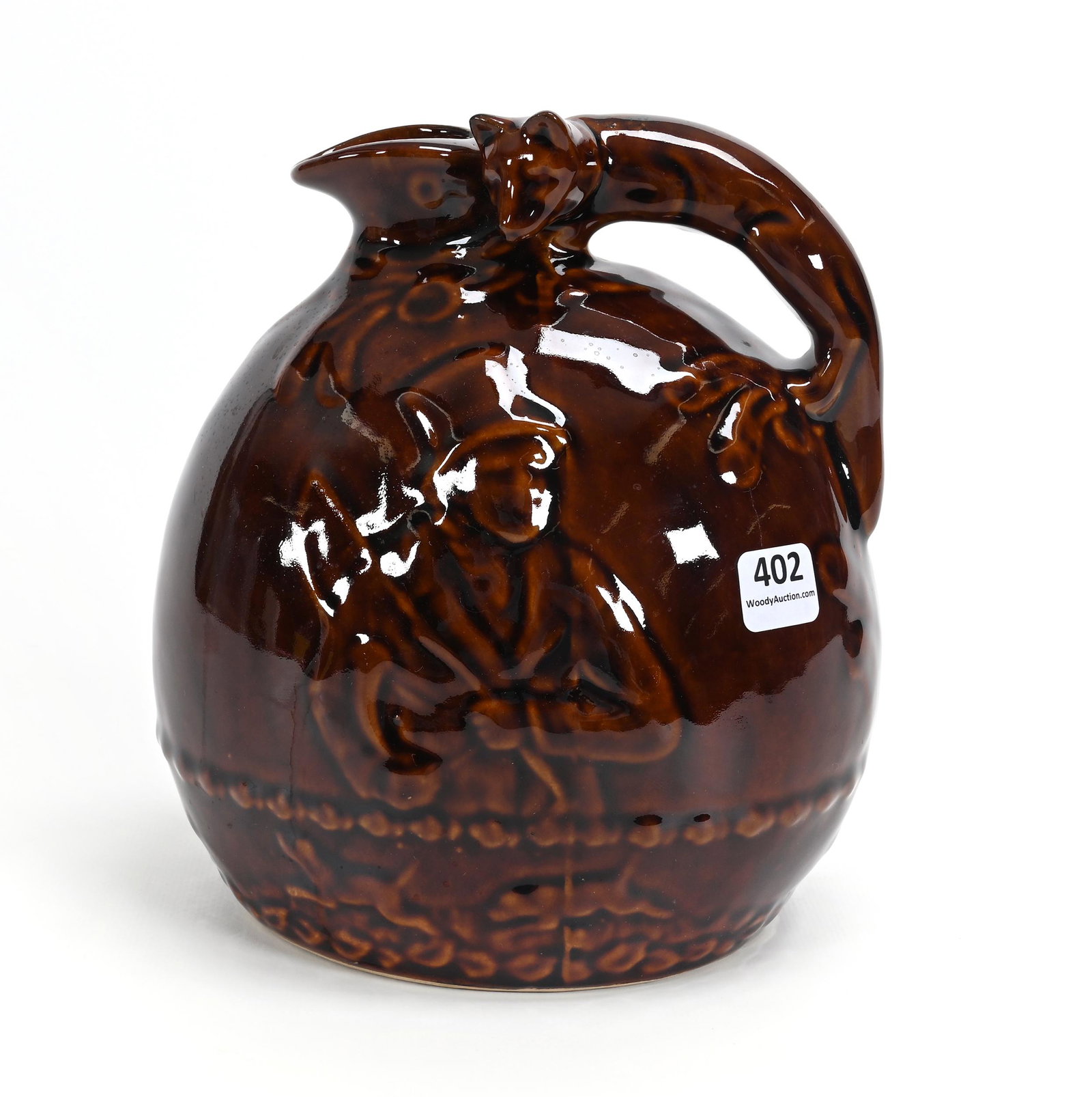 Jug Marked Rockingham, Brown Glaze: Jug Marked Rockingham, Brown Glaze, 7.5" x 7", Figural Fox Handle With Scene Of Fox Hunt, Larry & Sharla Michael.