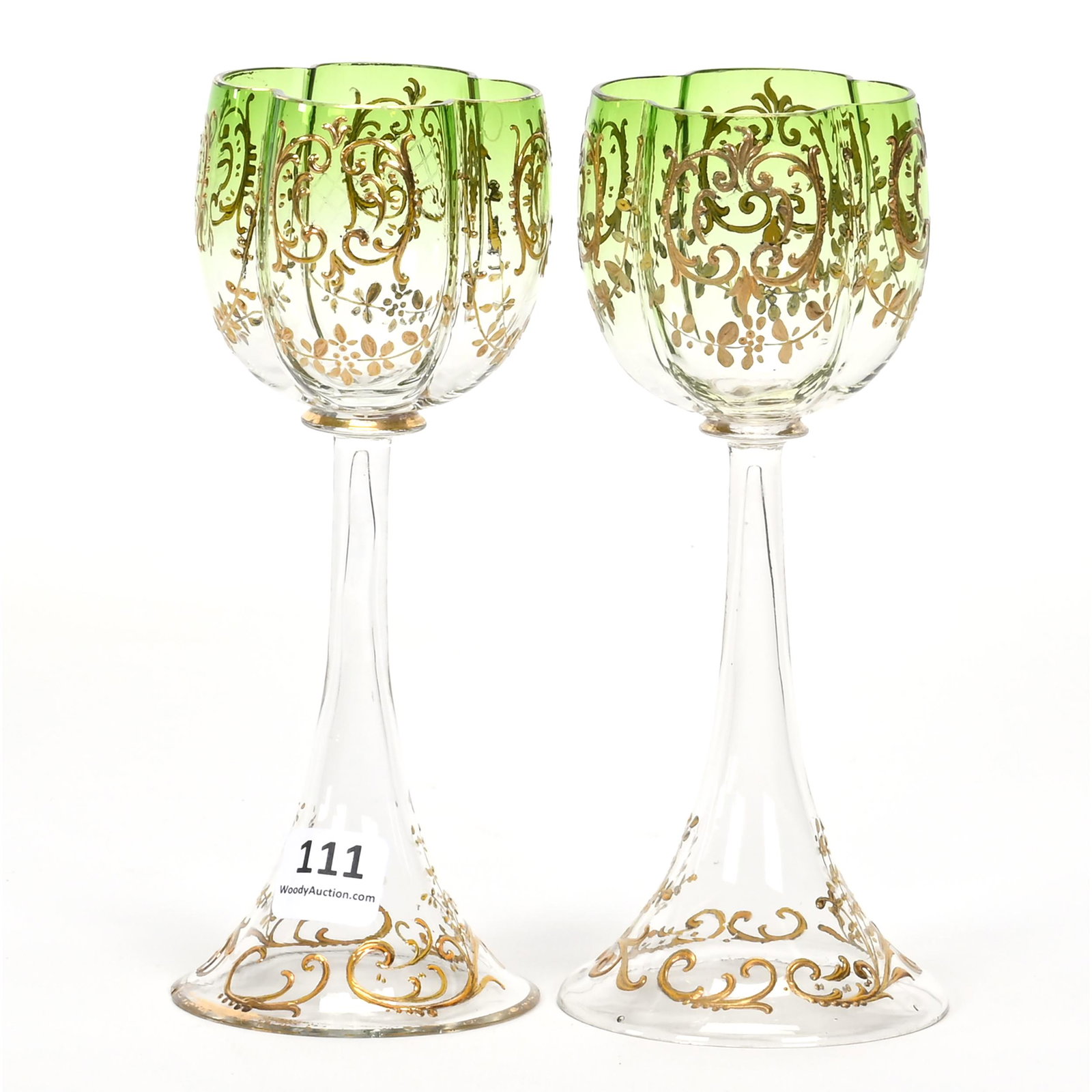 Pair Wine Stems, Moser Style Art Glass: Pair Wine Stems, Moser Style Art Glass, 6.75" x 2.75", Green Shading To Clear, Gold Enamel Floral And Scroll Design, The David & Marlene Howard Collection.