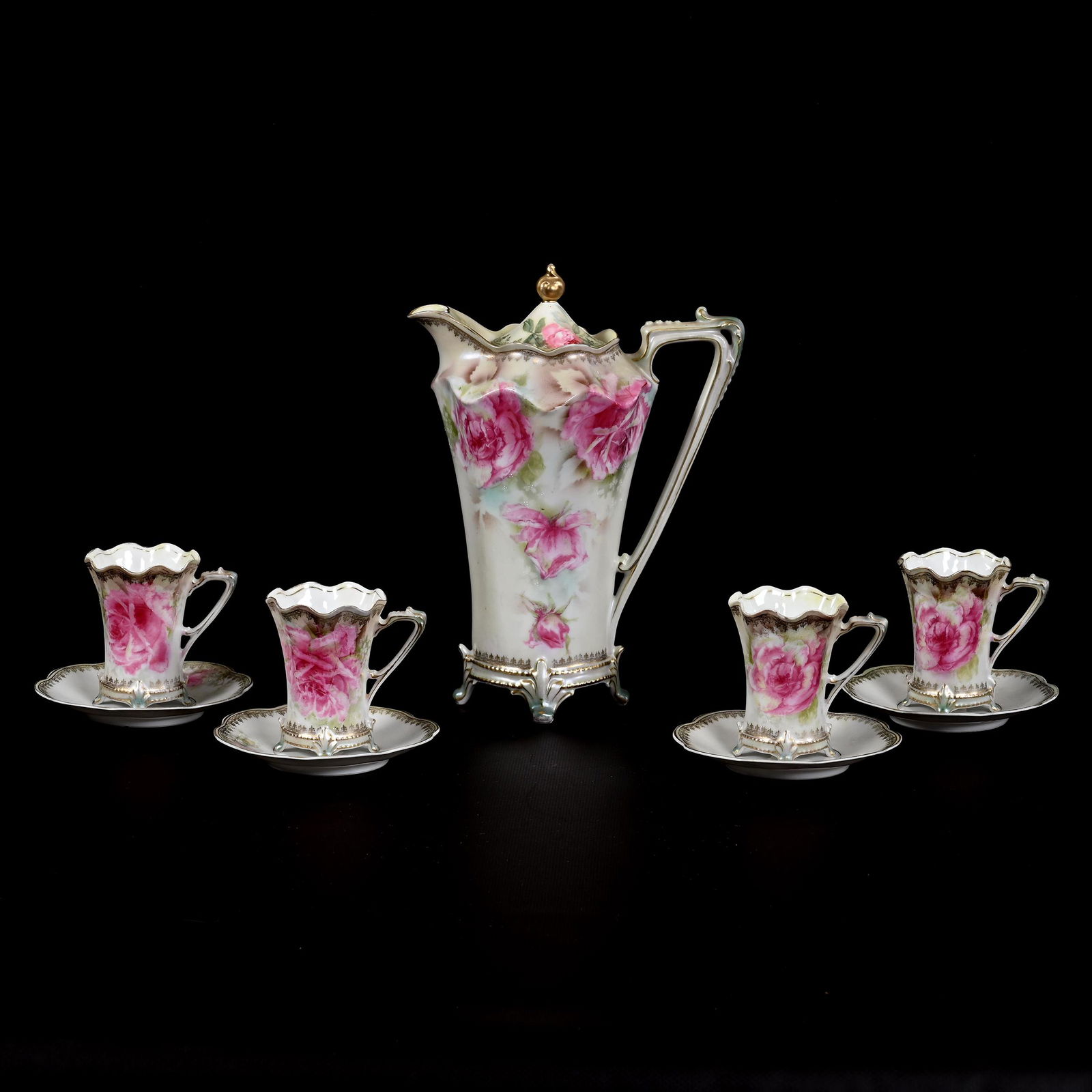 Chocolate Set Marked R.S. Prussia: Chocolate Set Marked R.S. Prussia, Cream And Green Tones, Large Pink Rose Decor, (1) 9.75" X 7.25" Chocolate Pot, (4) Matching Cups and Saucers, One Cup Has Faint Hairline, The David & Marlene Howard