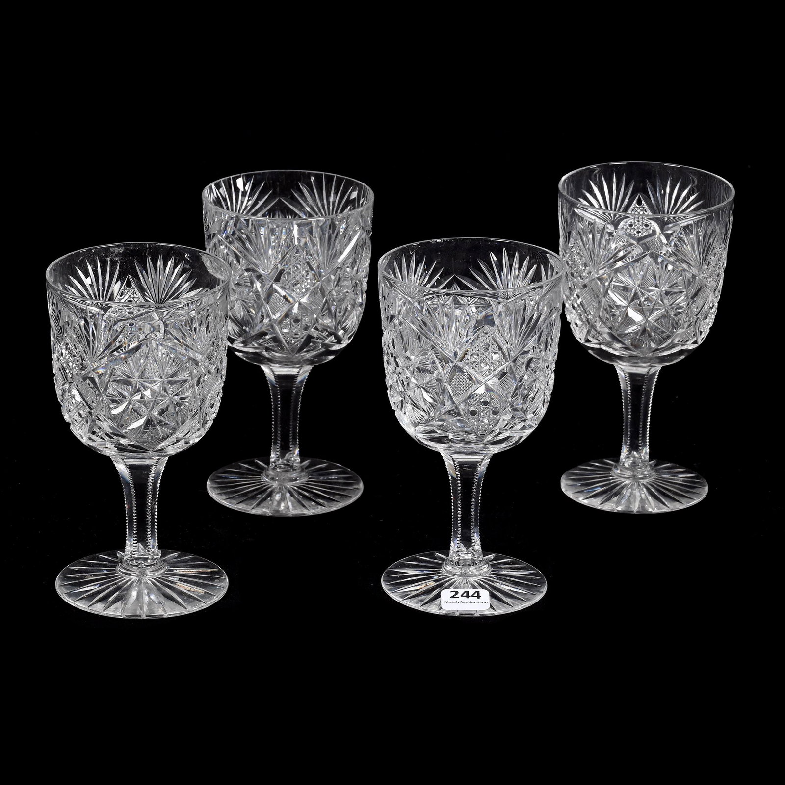 (4) Goblets, American Brilliant Cut Glass: (4) Goblets, American Brilliant Cut Glass, 6.25" x 3.375", Flashed Hobstar, Cane, Strawberry Diamond And Fan Motif, One Has Foot Polish, One Has Rim Polish, One Has Rim Chip, Joe Panico Collection Of 