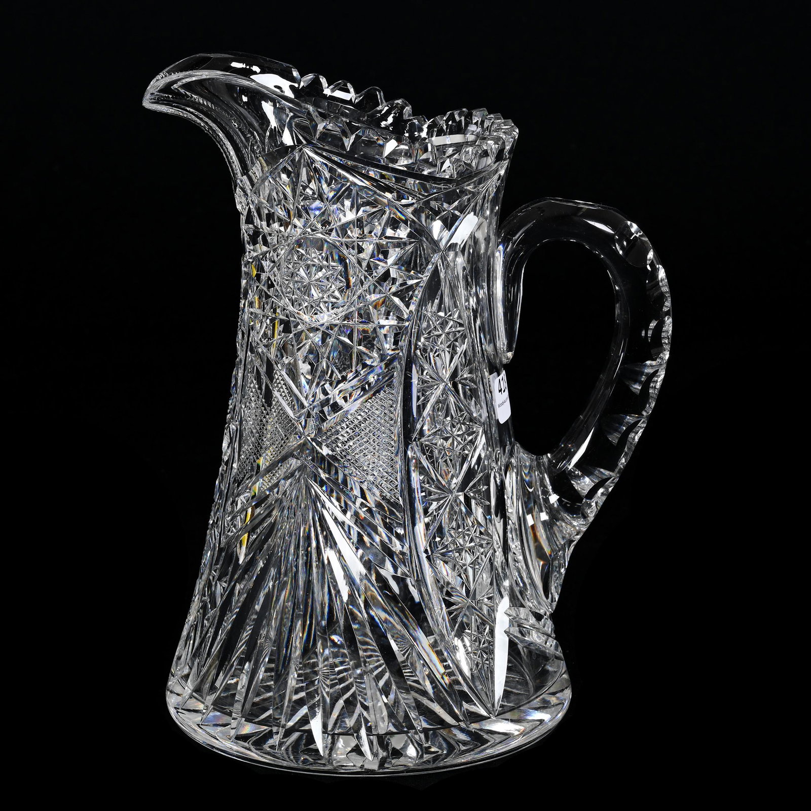 Water Pitcher, American Brilliant Cut Glass: Water Pitcher, American Brilliant Cut Glass, 10.25" x 8", Hobstar, Vesica, Strawberry Diamond And Fan Motif, Double Notched Handle, Ray Cut Base, Large Outside Rim Chip, Carl Putzka Collection, Texas.