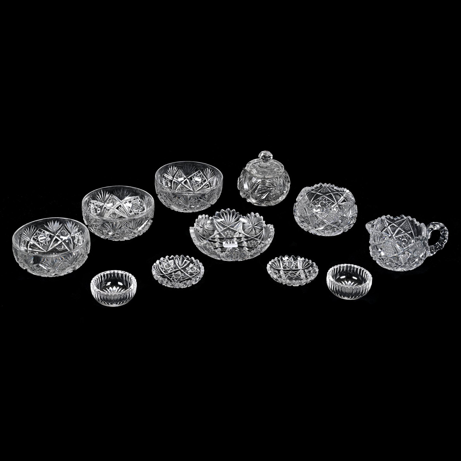 (10) Items, American Brilliant Cut Glass: (10) Items, American Brilliant Cut Glass, (3) 4.25" Finger Bowls, Holland Pattern By Hawkes, One Bowl Has Rim Chip, (1) 3.5" Mustard Jar, Pinwheel Motif, (1) 5" Nappy, Tooth Chip, (2) 3" Butter Pats, 