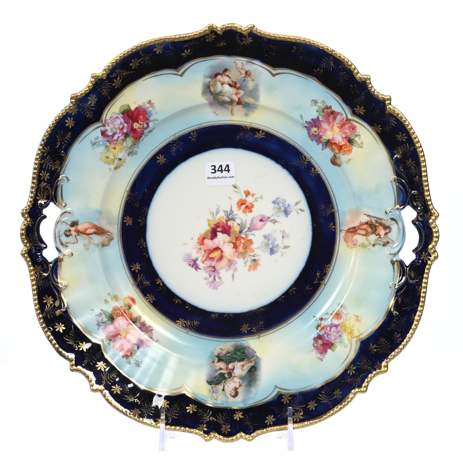 Cake Plate, Unmarked R.S. Prussia: Cake Plate, Unmarked R.S. Prussia, 12", Mold #343, White, Blue And Cobalt Blue With Wild Floral Decor, Images Of Women And Cherub, Michigan Private Collection.