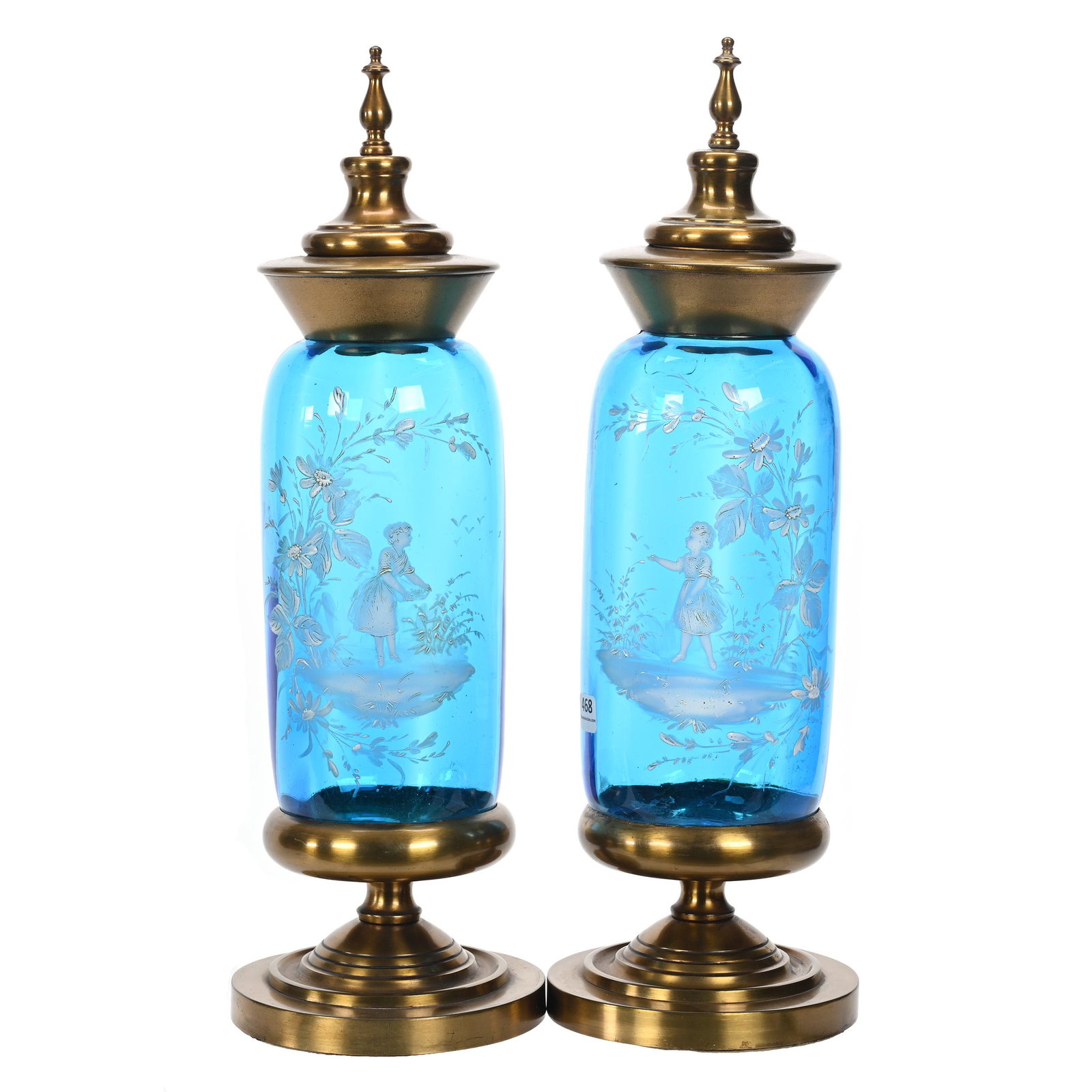 Pair Covered Urns, Blue Art Glass Bodies: Pair Covered Urns, Blue Art Glass Bodies, 18" x 5.75", Enamel Mary Gregory Type Scenic Decor, Mirror Images, Gilt Metal Base And Top, One Urn Has Crack On Top Back Side Of Body, Marvin & Kay Kraus, NE