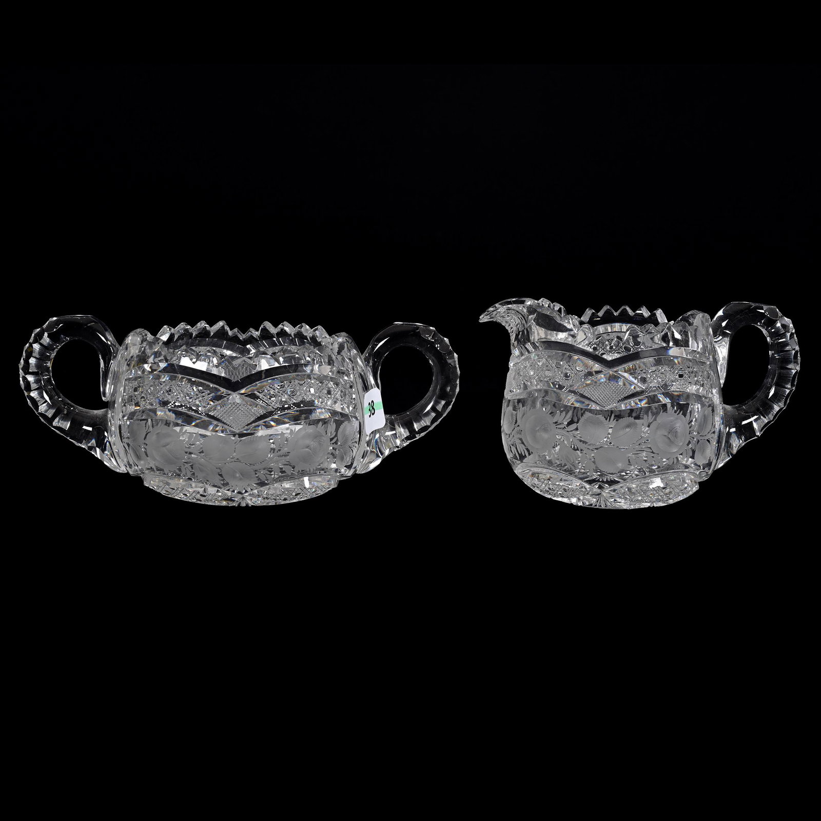 Creamer & Sugar Set, American Brilliant Cut Glass: Creamer & Sugar Set, American Brilliant Cut Glass, 3.25” x 7.5", Hobstar Center With Engraved Rose Vine, Cane And Strawberry Diamond Highlights, Spout Of Creamer Has Hard To See Bruise, Some Chips, 