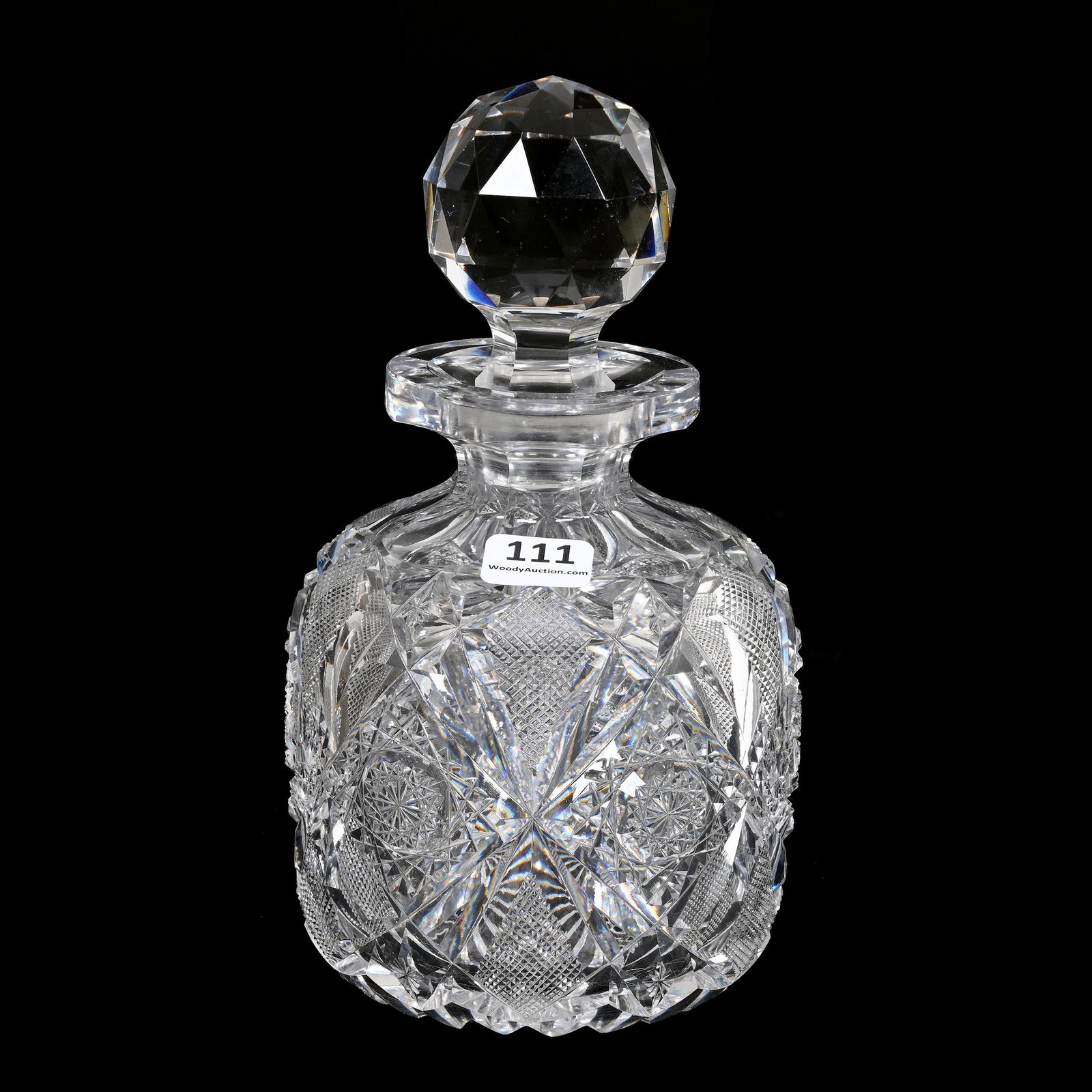 Cologne Bottle, American Brilliant Cut Glass: Cologne Bottle, American Brilliant Cut Glass, 7.75" x 4.25", Hobstar, Strawberry Diamond And Star Motif, Ray Cut Base, Clear Blank, Small Pattern Chip, Estate Of Dr. Barry and Dee Free.