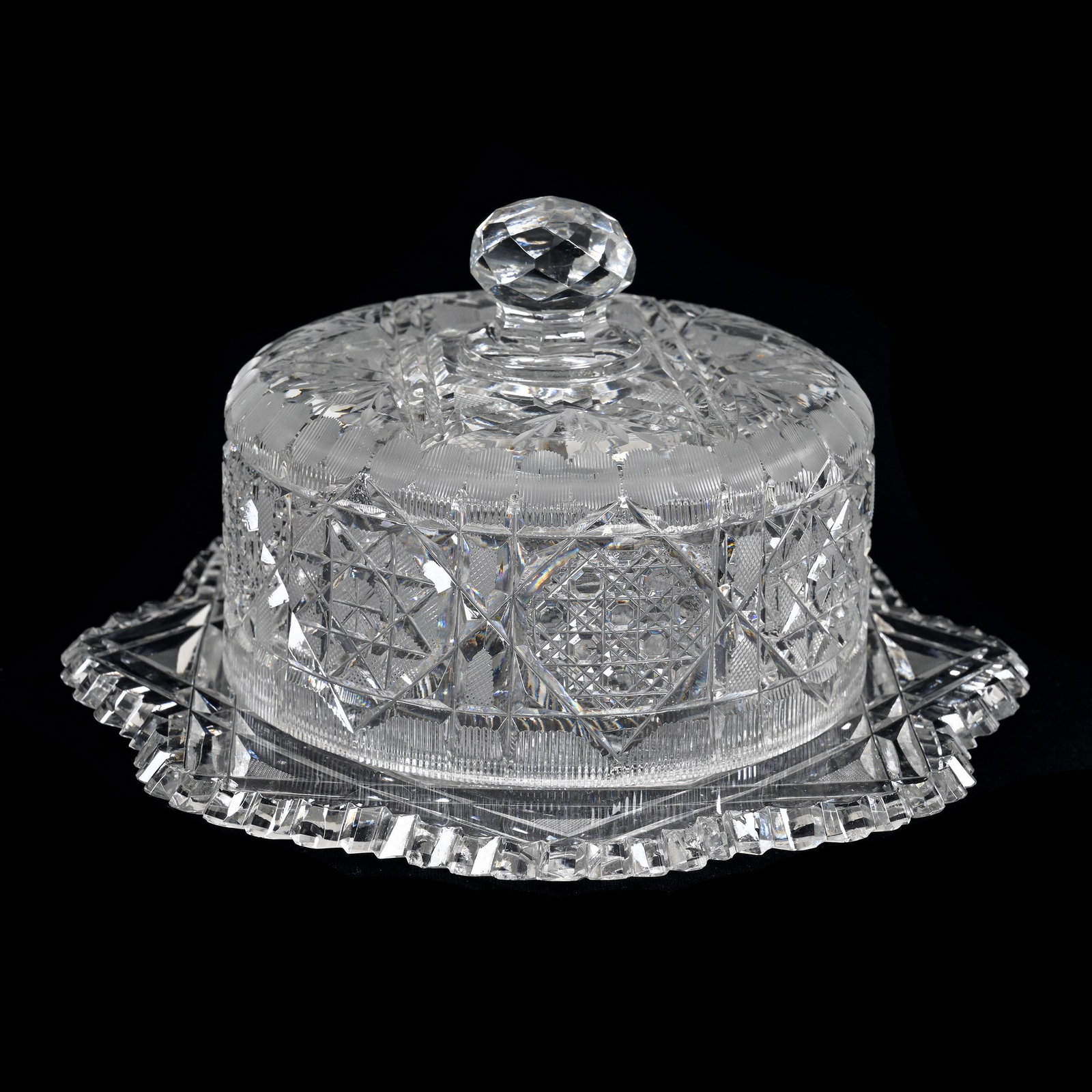 Covered Butterdish, American Brilliant Cut Glass: Covered Butterdish, American Brilliant Cut Glass, 4.25" x 7.25", Eight-Point Star With Cane, Strawberry Diamond, Pinwheel And Engraved Floral Highlights, Two Tooth Chips On Plate, Estate Of Dr. Barry 