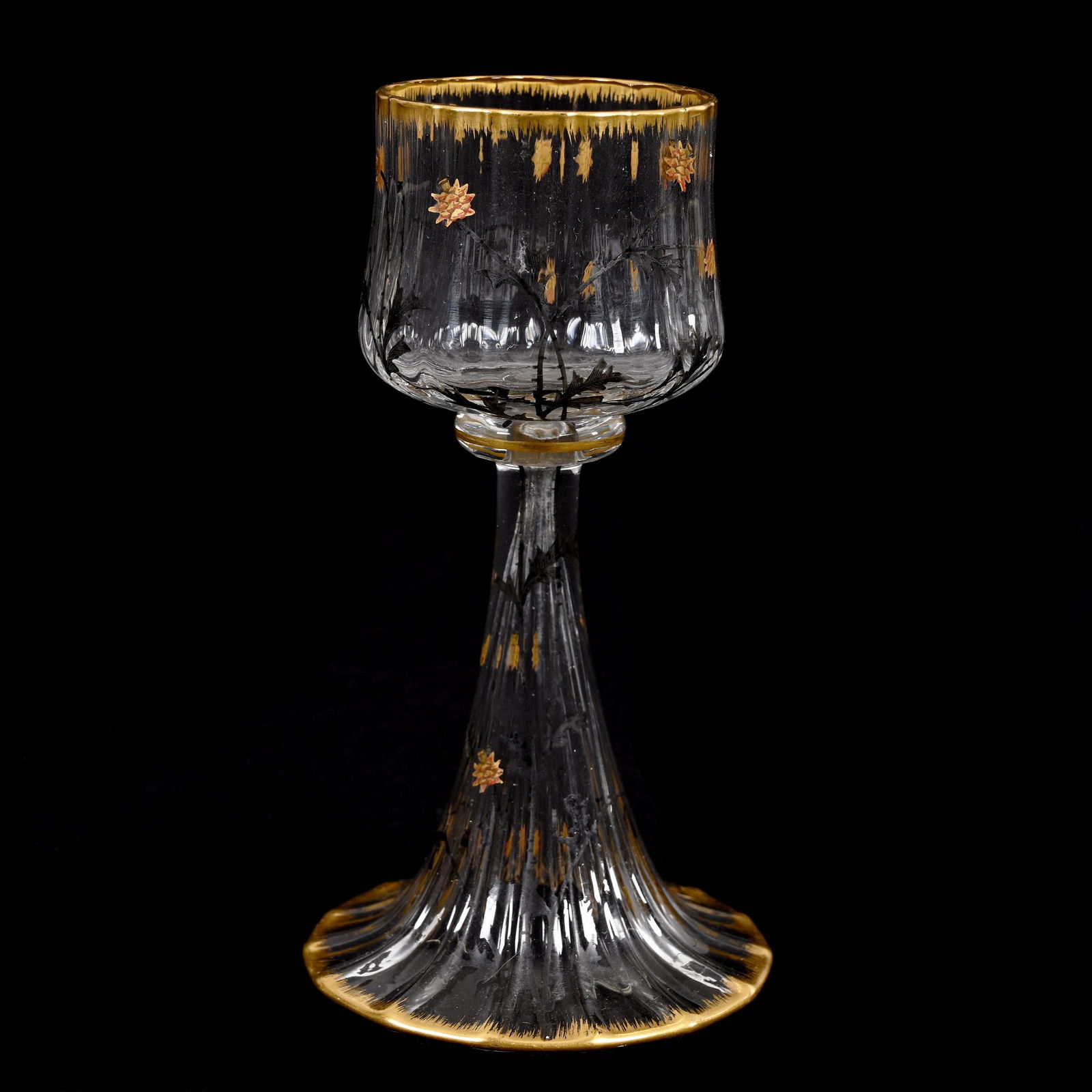 Wine Stem Signed Daum Nancy French Art Glass: Wine Stem Signed Daum Nancy French Art Glass, 5.25" x 2.75", Clear Optic Rib Art Glass With Enamel Thistle Decor, Gold Trim Highlights, Estate Of Dr. Barry and Dee Free.