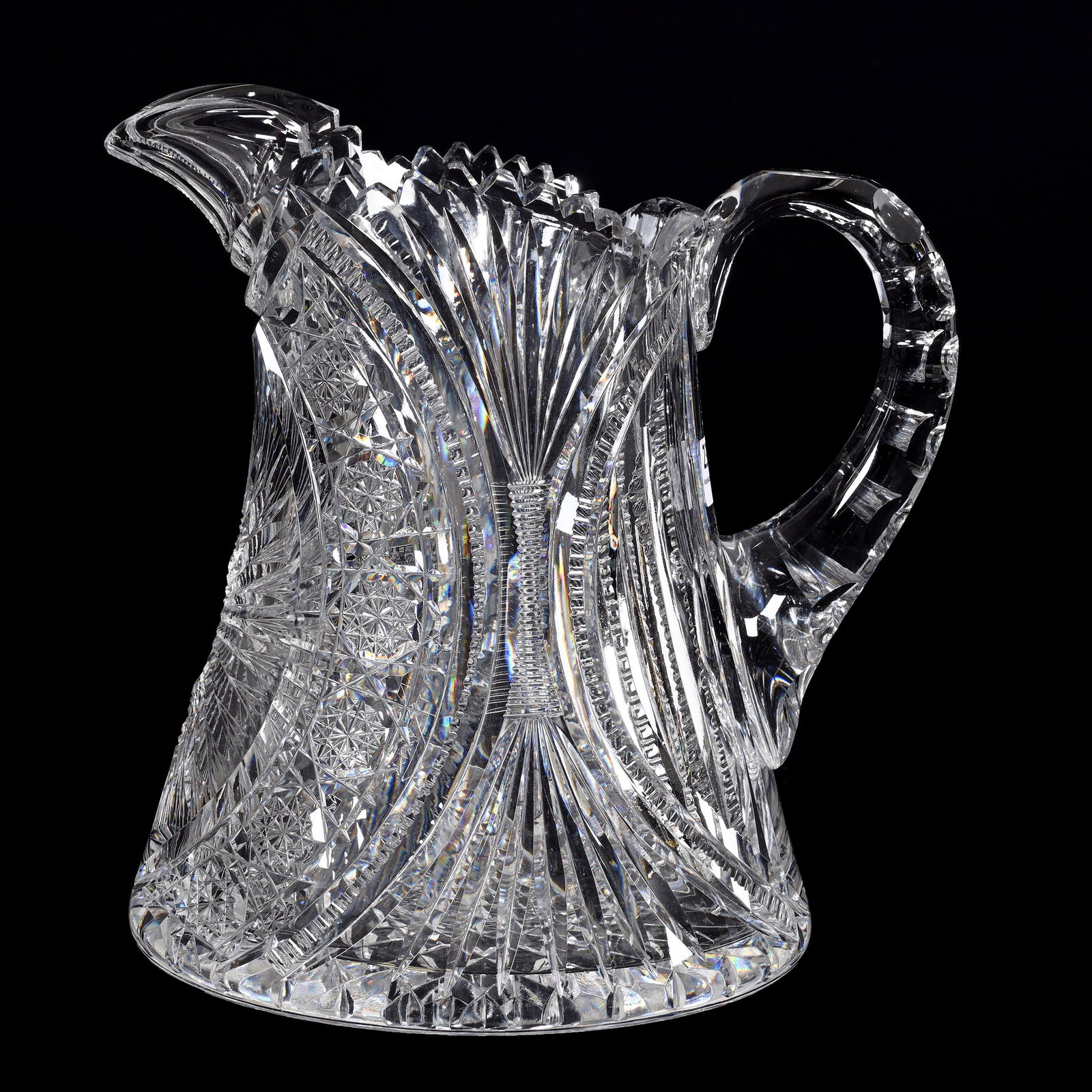 Pitcher, American Brilliant Cut Glass: Pitcher, American Brilliant Cut Glass, 9" x 8.75", Sunburst, Hobstar Chain, Prism, Zipper And Fan Motif, Double Notched Handle, Hobstar Base, Estate Of Dr. Barry and Dee Free.