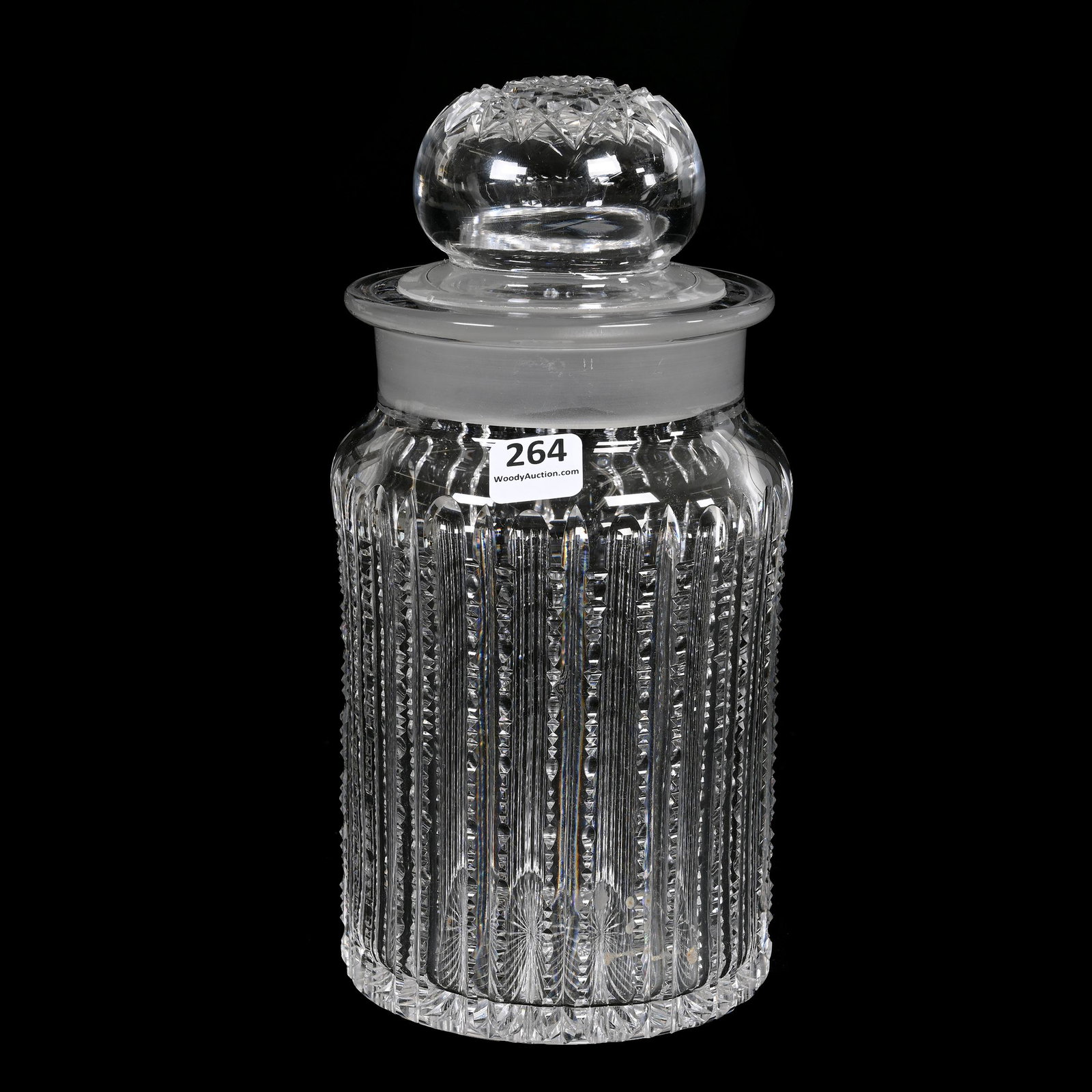 Humidor, American Brilliant Cut Glass: Humidor, American Brilliant Cut Glass, 9.25" x 4.5", Prism Cut Body, Hobstar Cut Lid, Ray Cut Base, Surface Chip On Top Interior Rim Of Jar, Nick On Rim Of Lid, Estate Of Dr. Barry and Dee Free.