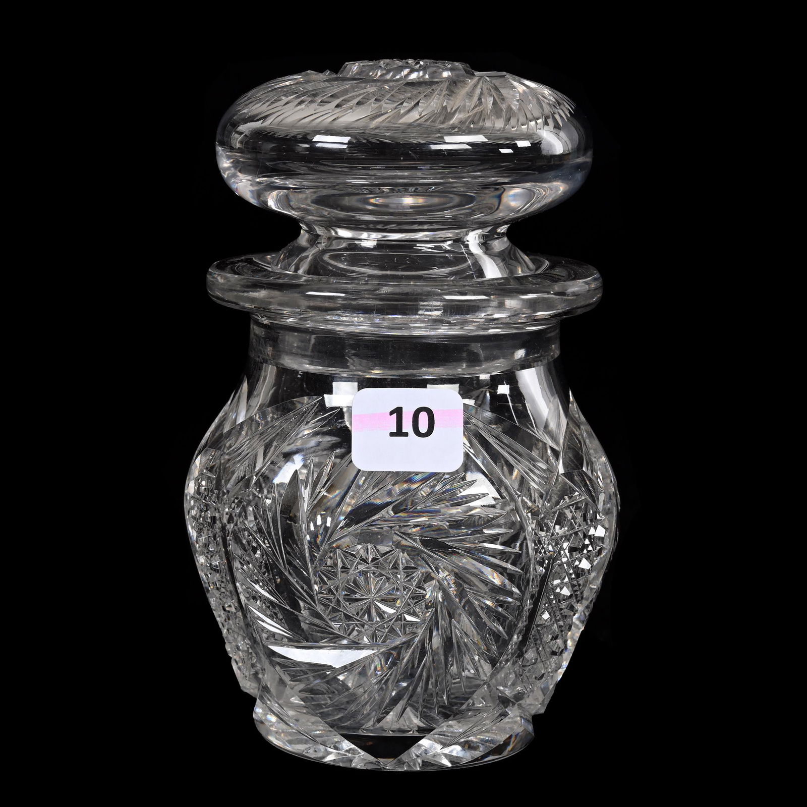 Covered Jar, American Brilliant Cut Glass: Covered Jar, American Brilliant Cut Glass, 5.5" x 3.75", Pinwheel, Cane And Fan Motif, Pattern Cut Lid, Ray Cut Base, Light Pattern Chips, One Pinwheel Panel Ground, Estate Of Dr. Barry and Dee Free.