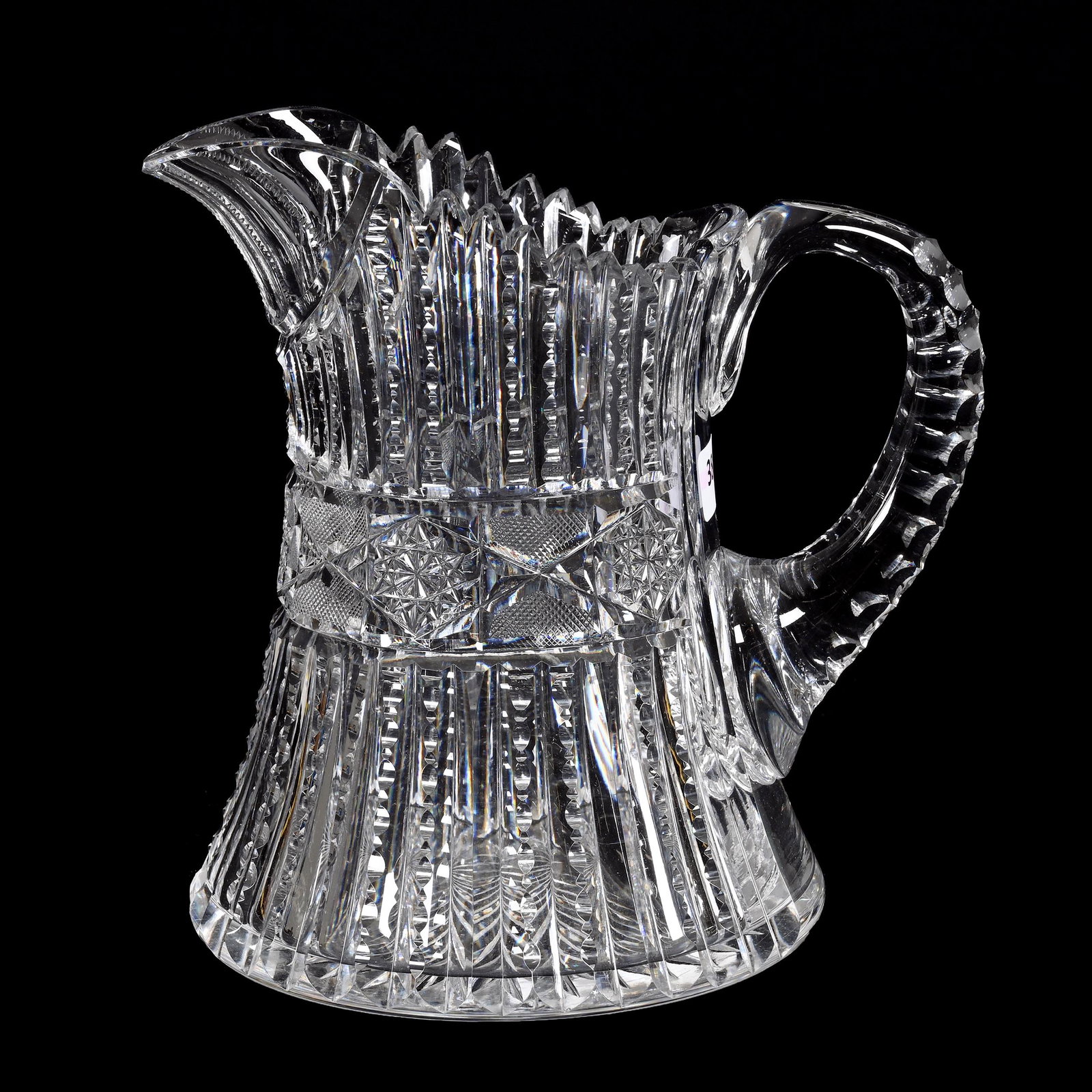 Water Pitcher, American Brilliant Cut Glass: Water Pitcher, American Brilliant Cut Glass, 8" x 8", Prism Cut Body With Hobstar And Strawberry Diamond Band Highlights, Triple Notched Handle, Ray Cut Base, Tooth Chip, Estate Of Dr. Barry and Dee F