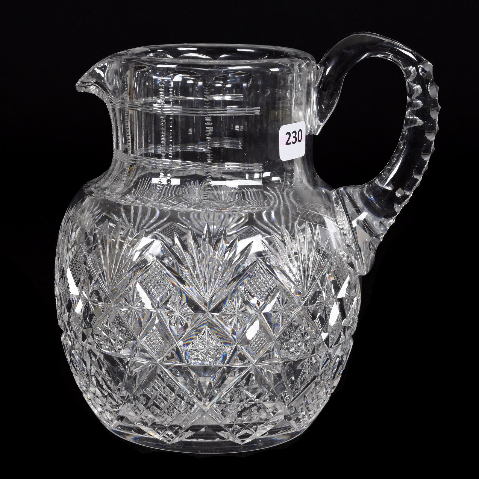 Pitcher, American Brilliant Cut Glass: Pitcher, American Brilliant Cut Glass, 8.25" x 7.25", Hobstar, Strawberry Diamond, Crosscut Diamond, Star And Fan Motif, Triple Notched Handle, Ray Cut Base, Estate Of Dr. Barry and Dee Free.