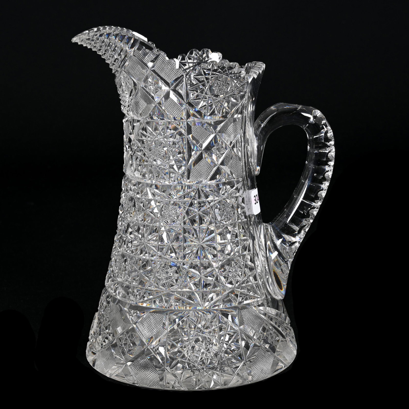 Water Pitcher, American Brilliant Cut Glass: Water Pitcher, American Brilliant Cut Glass, 9.75" x 7.5", Pattern Resembles Royal By Hunt, Step Cut Spout, Double Notched Handle, Ray Cut Foot, Estate Of Dr. Barry and Dee Free.