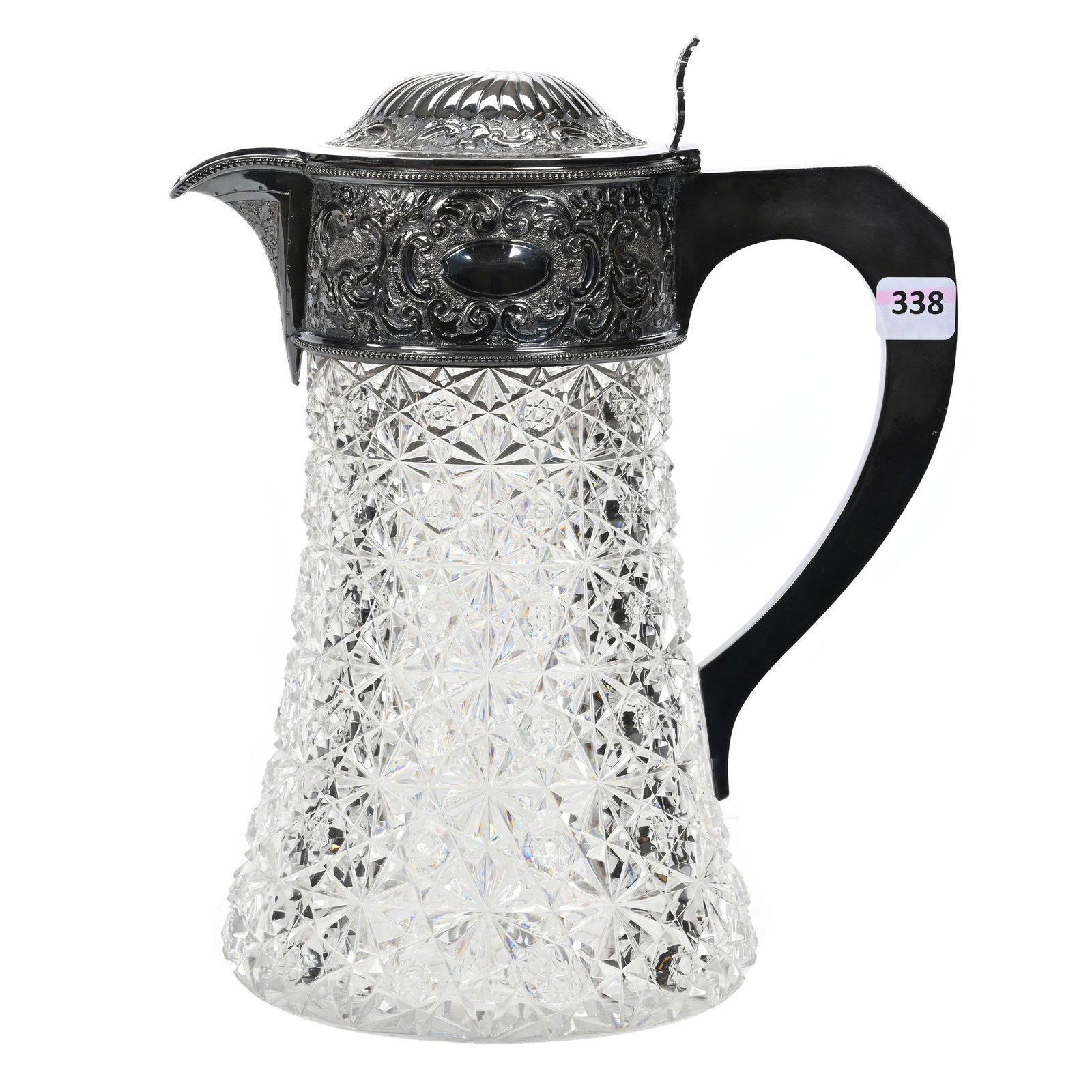 Pitcher, BPCG: Pitcher, Brilliant Period Cut Glass, 10.75" x 8.75", Full Russian Cut Pattern, Hobstar Buttons, Ray Cut Base, Elaborate Silverplate Spout, Lid And Handle, Estate Of Dr. Barry and Dee Free.