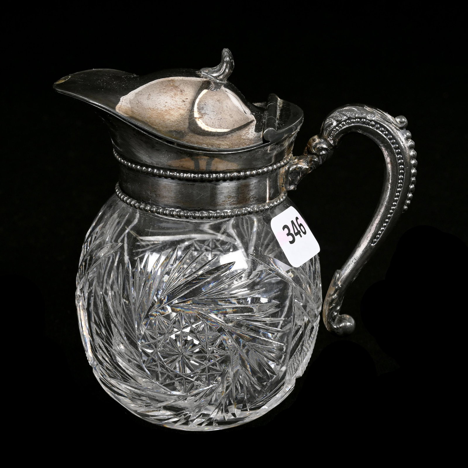 Syrup Pitcher, American Brilliant Cut Glass: Syrup Pitcher, American Brilliant Cut Glass, 4.75" x 4.5", Pinwheel, Strawberry Diamond And Fan Motif, Ray Cut Base, Silverplate Spout And Handle, Estate Of Dr. Barry and Dee Free.