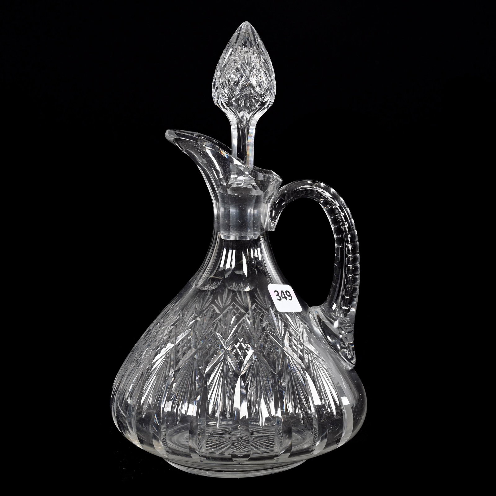 Decanter, American Brilliant Cut Glass: Decanter, American Brilliant Cut Glass, 10" x 5.75", Diamond And Fan Motif, Pattern Cut Stopper, Hollow Notched Handle, Ray Cut Base, Estate Of Dr. Barry and Dee Free.