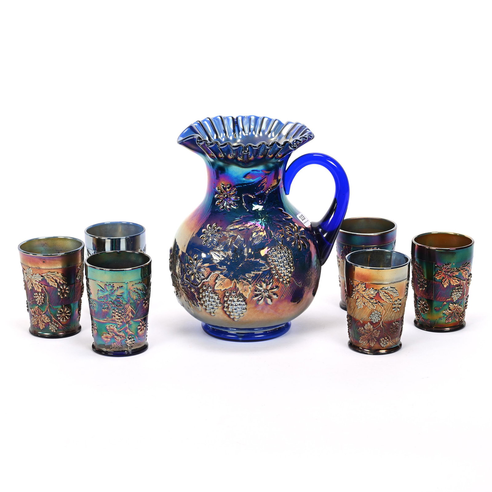 Water Set, Carnival Glass, Floral & Grape, Blue: Water Set, Carnival Glass, Floral & Grape, Blue, By Fenton, (1) 9.5" Pitcher, (6) 4" Tumblers, Patsy Creveling Collection.