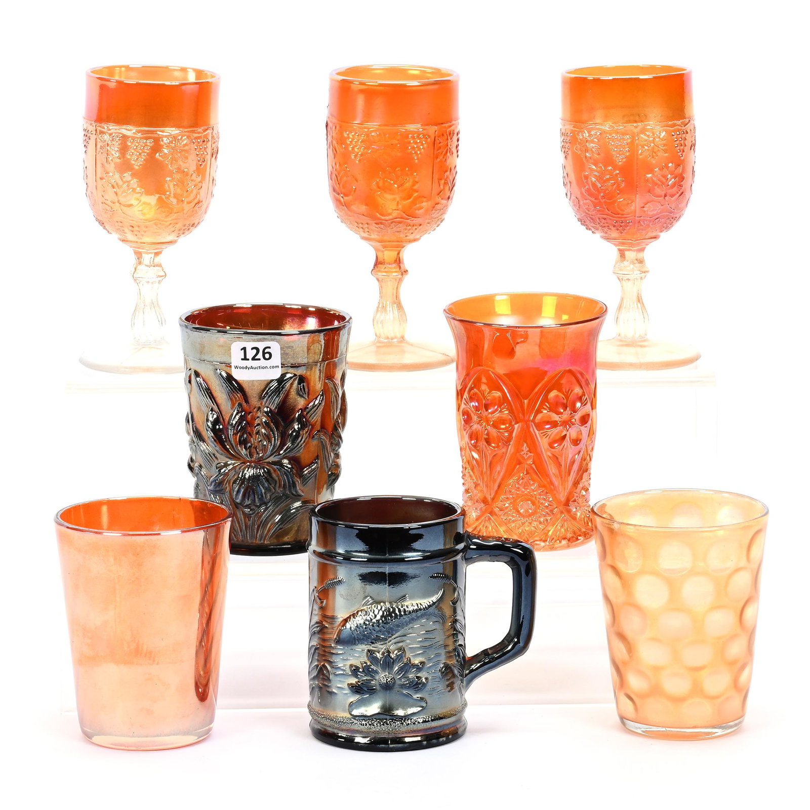 (8) Assorted Items, Carnival Glass: (8) Assorted Items, Carnival Glass, (3) 5.5" Wine & Roses Pattern Wines, Marigold, (1) Heavy Iris Tumbler, Amethyst, (1) Four-Seventy-Four Tumbler, Marigold, (1) Northwood's Swirled Rib Tumbler, Marig