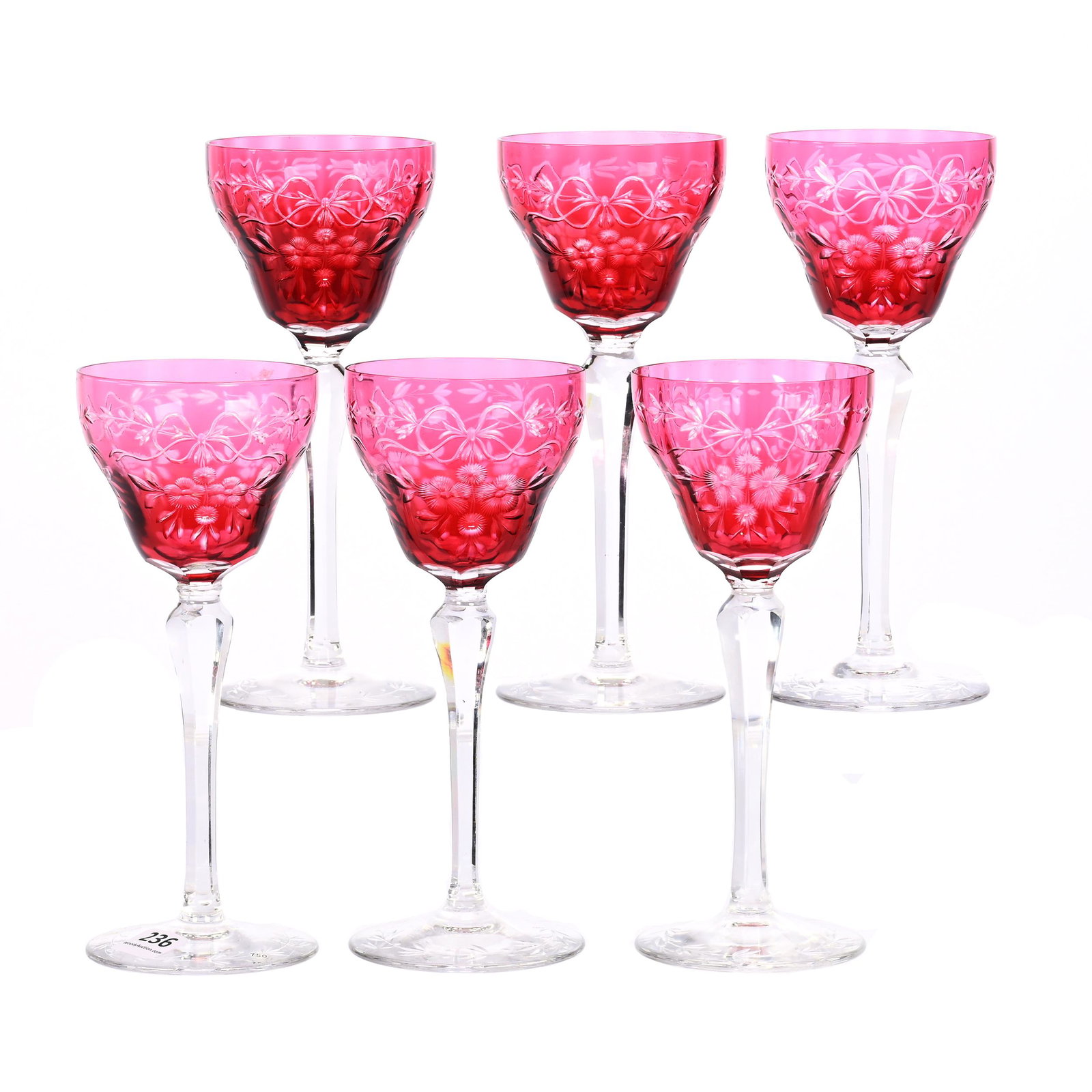 (6) Wine Stems, BPCG, Cranberry Cut To Clear: (6) Wine Stems, Brilliant Period Cut Glass, Cranberry Cut To Clear, 7.25" x 3", Engraved Floral Garland And Bowtie Design, Nancy And Taylor Abernathy Collection.