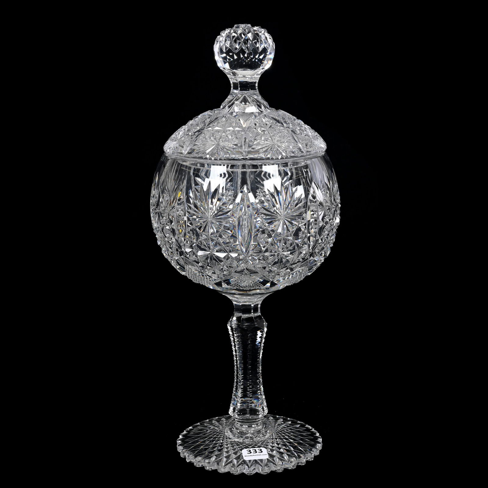 Covered Compote/Chalice, Cut Glass: Covered Compote/Chalice, Cut Glass, 15.5" x 6.25", Cut In Style Of Grecian By Hawkes, Scalloped Hobstar Foot, Full Pattern Cut Lid, This Item Does Not Black Light, Woody Auction Cannot Guarantee The T