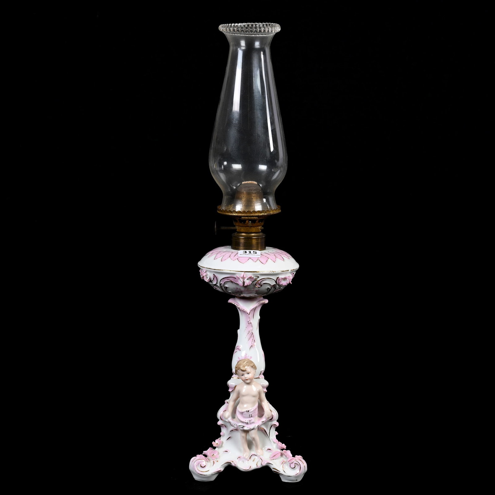 China Kerosene Lamp Marked Rudolstadt: China Kerosene Lamp Marked Rudolstadt, 12" x 4.5", Pink And White With Figure Of Putti, Sidlinger Estate Collection, North Carolina.