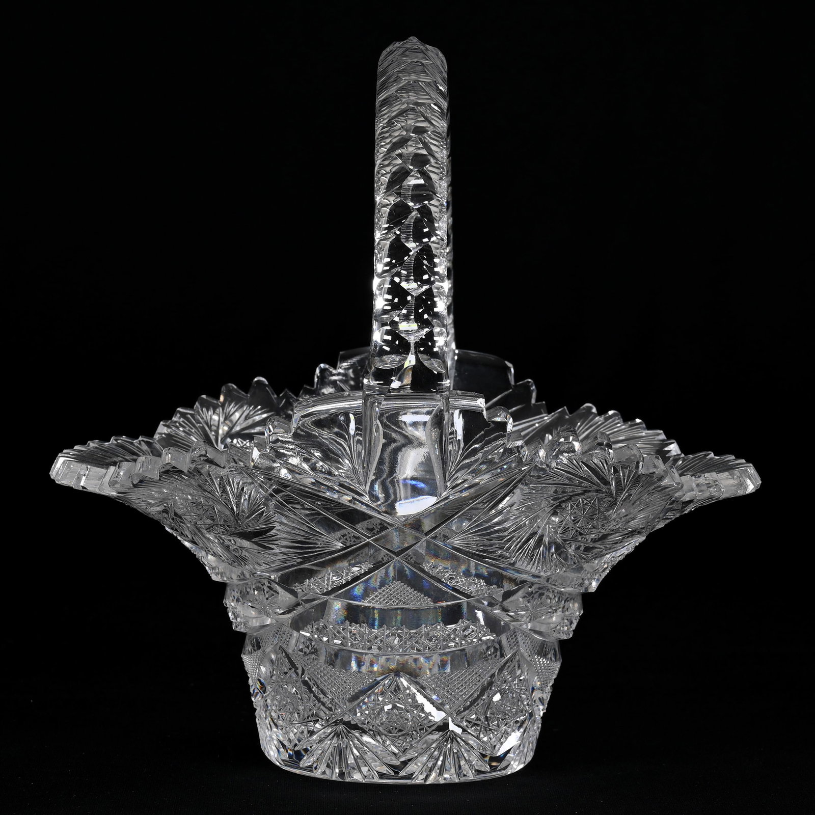 Basket, American Brilliant Cut Glass: Basket, American Brilliant Cut Glass, 7.75" x 7.75" x 7", Pinwheel, Hobstar, Cane, Strawberry Diamond And Fan Motif, Triple Notched Handle, Hobstar Base, Virginia Chaplin Collection, VA.