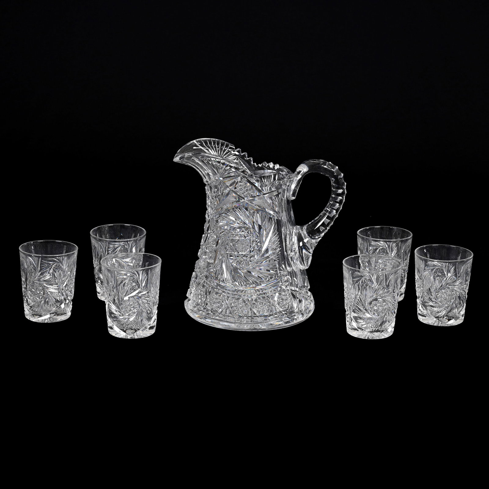 Water Set, American Brilliant Cut Glass: Water Set, American Brilliant Cut Glass, Pinwheel, Hobstar, Strawberry Diamond, Prism And Fan Motif, Triple Notched Handle, Ray Cut Base, (1) 9" x 9" Pitcher, (6) Matching 3.75" x 3" Tumblers, Virgini