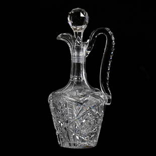 Handled Decanter, ABCG: Handled Decanter, American Brilliant Cut Glass, 12.5" x 6", Hobstar, Strawberry Diamond, Cane, Zipper, Star And Fan Motif, Triple Notched Handle, Ray Cut Base, There Is Handle Crack At Lower Attachmen