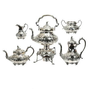 Silverplate Tea & Coffee Service, Five Piece: Matched Set With Embossed Floral And Scroll Design With Figural Tropical Bird Finials, (1) 17.5" x 10.5" Hot Water Pot On Tiltable & Removable Base With Heater, (1) 10" x 10" Demitasse Pot, (1) 7" x 1