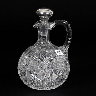 Ovoid Whiskey Decanter, ABCG: Ovoid Whiskey Decanter, American Brilliant Cut Glass, 8.75" x 5.5", Hobstar, Strawberry Diamond, Prism And Fan Motif, Triple Notched Handle, Ray Cut Base, Sterling Silver Stopper By Unidentified Maker