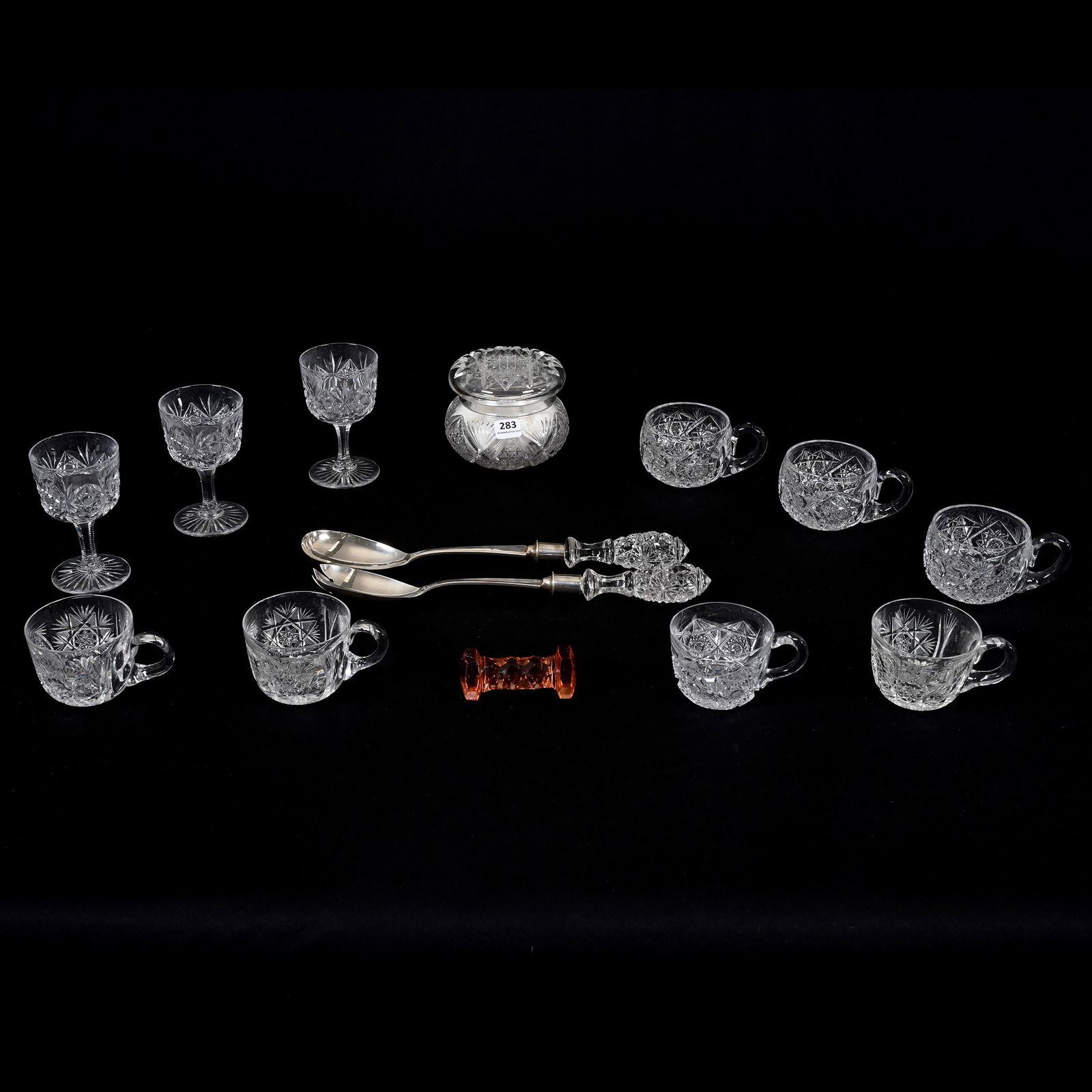 (14) Cut Glass Items, Most Are American Brilliant Cut Glass: (14) Cut Glass Items, Most Are American Brilliant Cut Glass, (7) Punch Cups In Various Patterns & Designs, (1) Covered Powder Box, (3) 4.25" Wine Stems, (1) 3" Solid Rose Color Knife Rest, Rim Chip, (