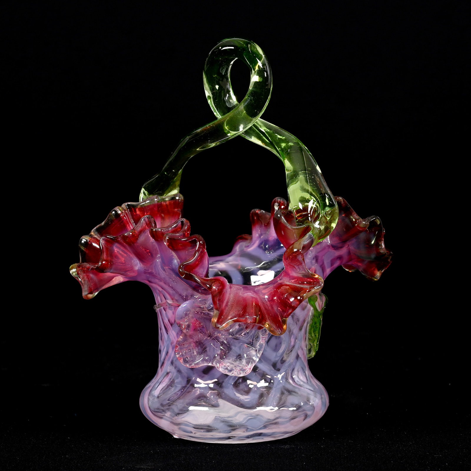 Basket, Cranberry Opalescent Art Glass: Basket, Cranberry Opalescent Art Glass, 6.25" x 4.5", Open Concentric Diamonds Pattern, Applied Apple Green Handle And Applied Leaves, Highly Reactive Under Black Light, Some Roughness On A Branch, Vi