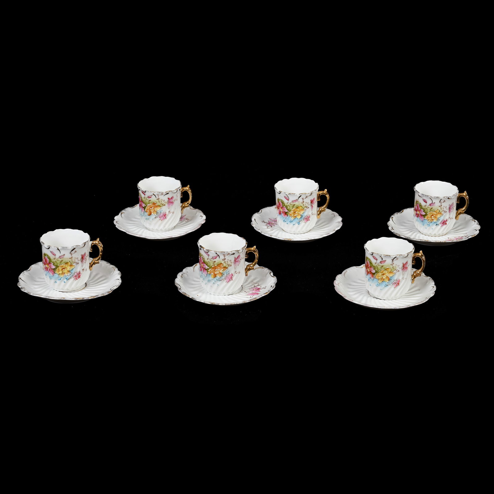 (6) Demitasse Cups/Saucers, Unmarked R.S. Prussia: (6) Demitasse Cups/Saucers, Unmarked R.S. Prussia, 2" x 3.75", Swirl Mold, White With Colorful Floral Decor, Gold Trim Highlights, One Cup Has Hairline, Lee & Carol Marple Collection.