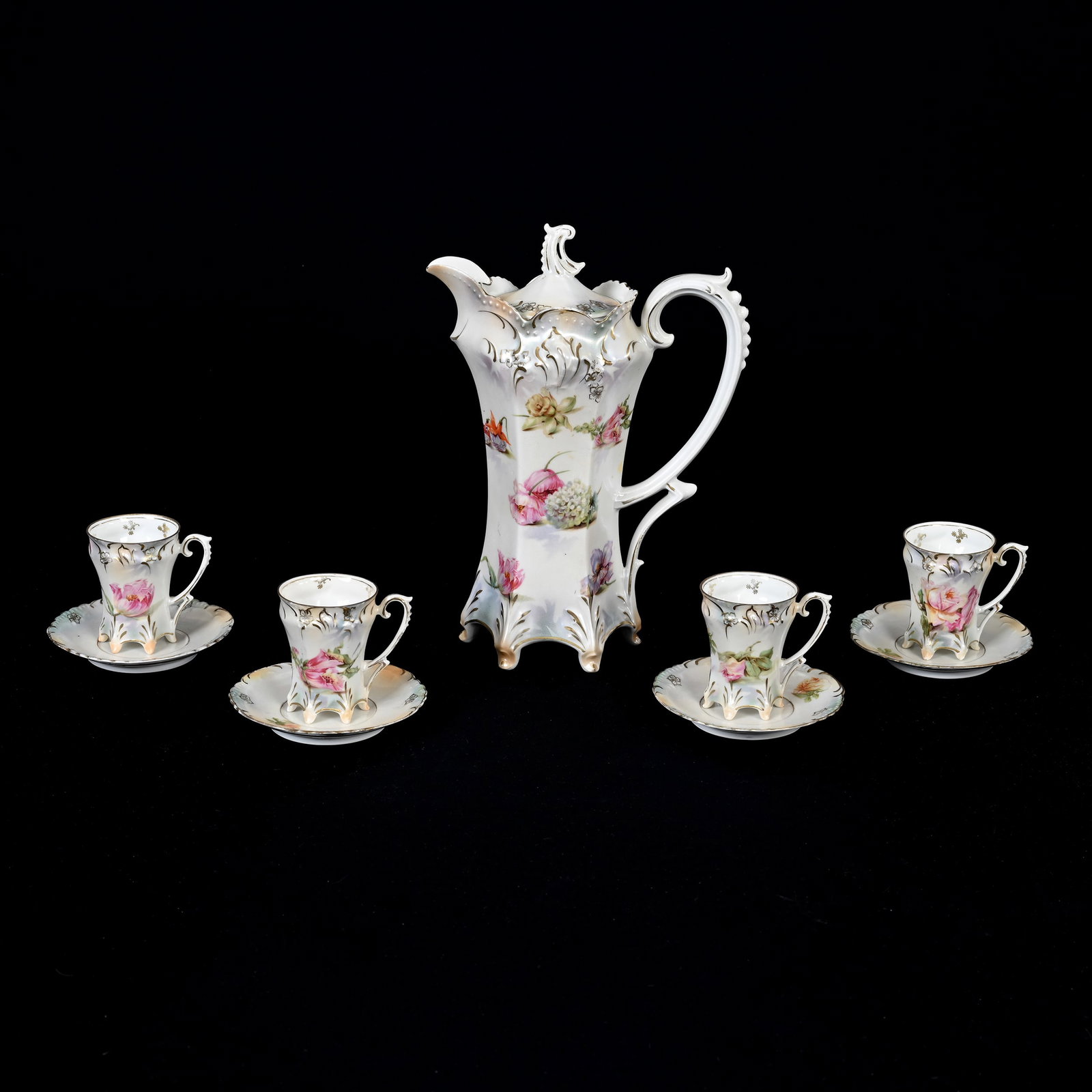 Chocolate Set Marked R.S. Prussia: Chocolate Set Marked R.S. Prussia, White And Green Satin Finish, Scattered Floral Decor, (1) 10.5" X 7.75" Chocolate Pot, (4) Matching Cups And Saucers, One Saucer With Hairline, Harold & Joeleen Pass