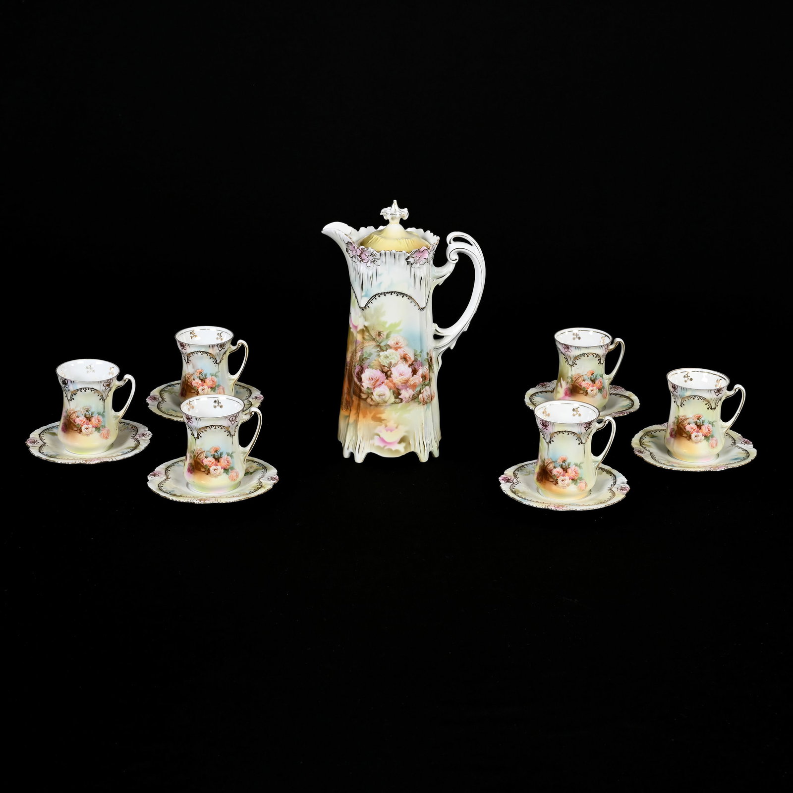 Chocolate Set Marked R.S. Prussia: Chocolate Set Marked R.S. Prussia, Icicle Mold, Spilled Basket Decor, (1) 9.5" X 6" Chocolate Pot, (6) Matching Cups And Saucers, Very Nice Set, Rim Nick On One Cup, Harold & Joeleen Passow, Iowa.