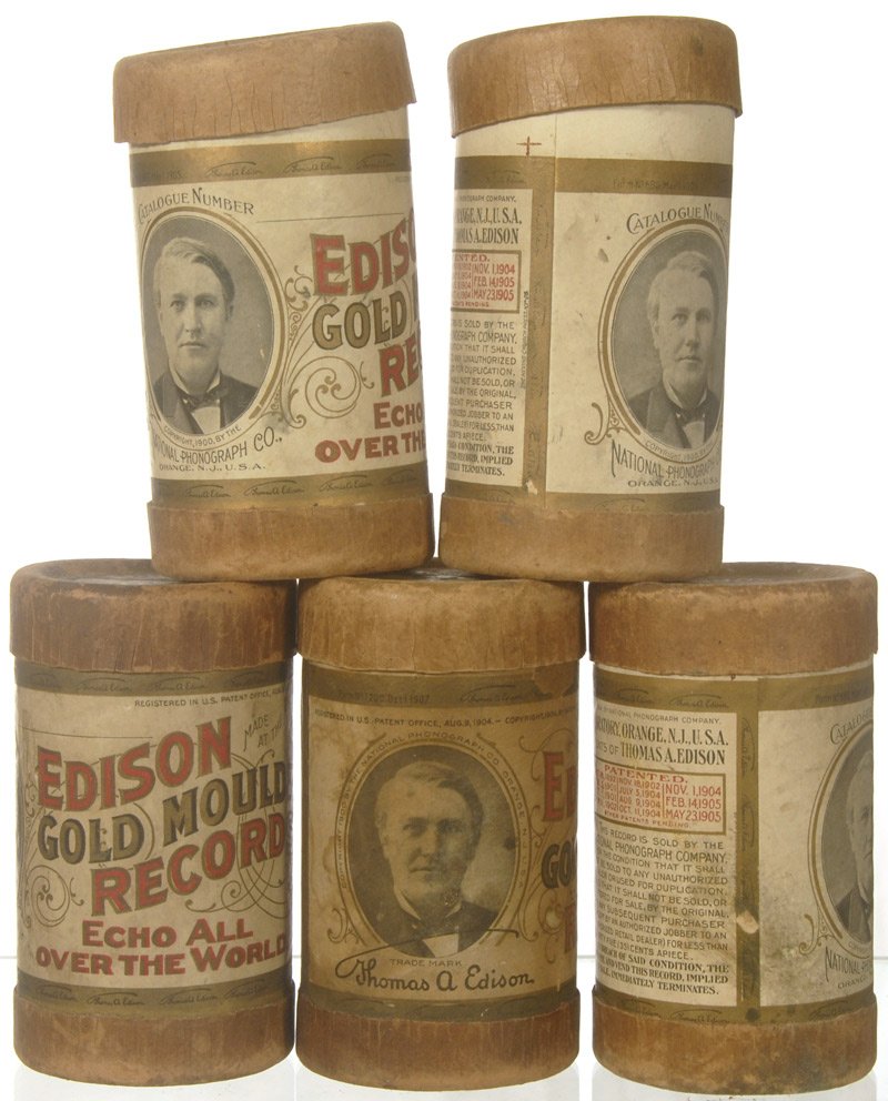 (5) ORIGINAL EDISON BLACK AMBEROL CYLINDER RECORDS I: (5) ORIGINAL EDISON BLACK AMBEROL CYLINDER RECORDS IN CASES W/ LABELS INCLUDES: THE PREACHER AND THE BEAR; EV'RY LITTLE BIT; THE STAR SPANGLED BANNER; THE TALE OF THE BUCKET (COMIC SONG); AND WHEN FAT