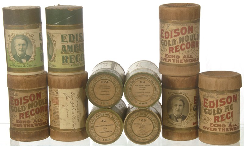 (11) ORIGINAL EDISON EMBEROL CYLINDER RECORDS IN GR: (11) ORIGINAL EDISON EMBEROL CYLINDER RECORDS IN GREEN & BROWN CASES W/ LABELS INCLUDES: MOVING DAY AT PUMPKIN CENTER; CUDDLE UP A LITTLE CLOSER LOVEY MINE; NEGRO RECOLLECTIONS; REELS AND WALK AROUNDS