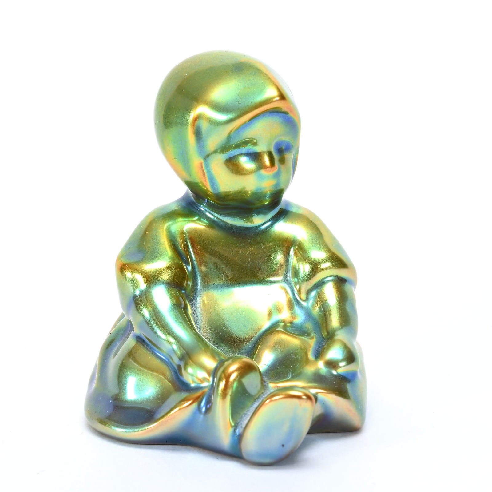 Figurine Marked Zsolnay: Figurine Marked Zsolnay, 3" x 3", Young Child Sitting, Green Iridescence, Texas Private Collection.