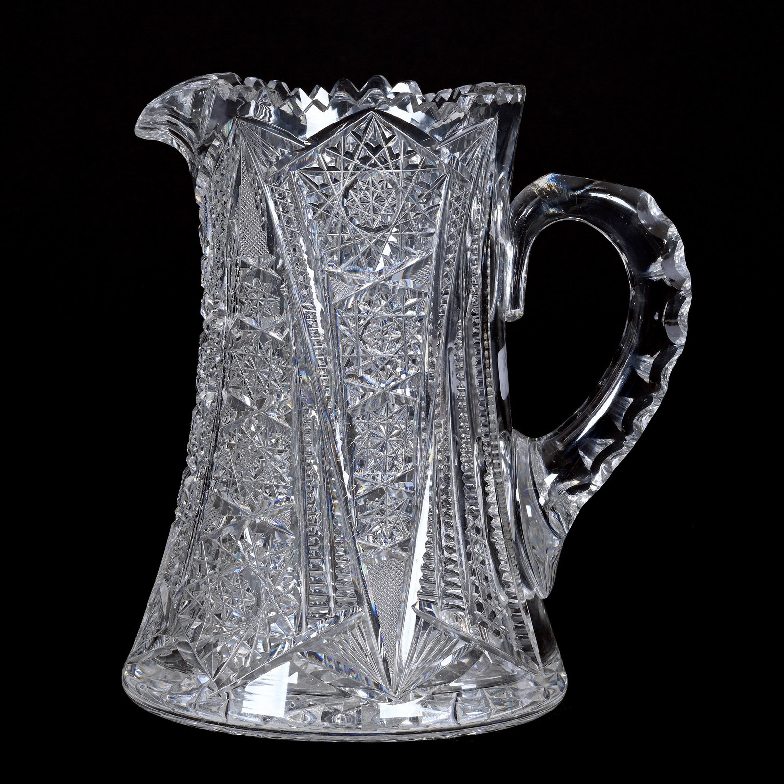 Pitcher, American Brilliant Cut Glass: Pitcher, American Brilliant Cut Glass, 8.75" x 7.75", Hobstar, Nailhead Diamond, Strawberry Diamond, Prism And Fan Motif, Double Notched Handle, Hobstar Base, The Ruth & Charles Kwartler Collection.