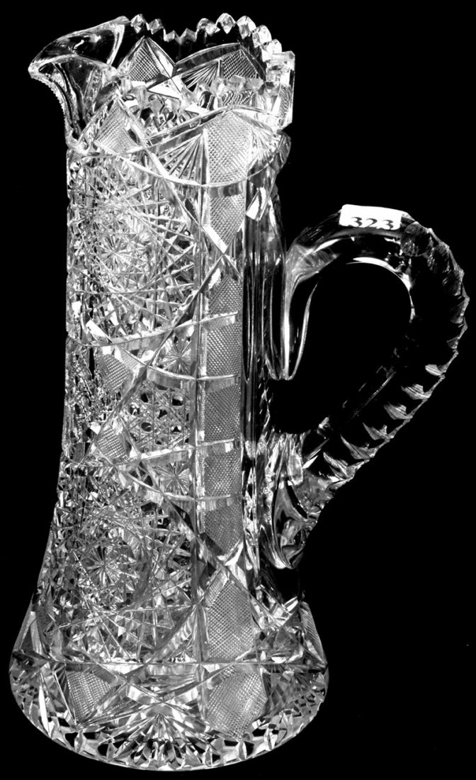 11" AMERICAN BRILLIANT CUT GLASS TANKARD: 11" AMERICAN BRILLIANT CUT GLASS TANKARD HOBSTAR, CANE, STRAWBERRY DIAMOND, STAR AND FAN MOTIF - TRIPLE NOTCHED HANDLE - HOBSTAR BASE